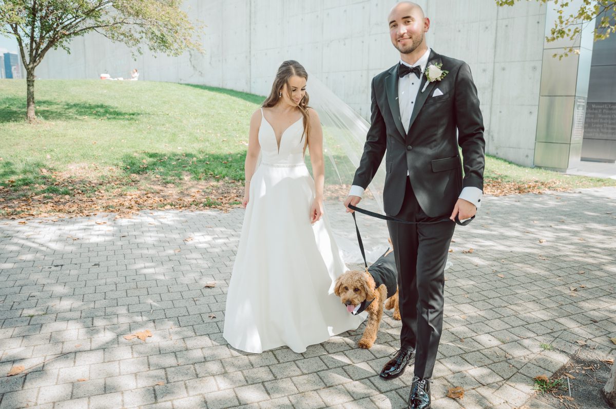 Melanie and Calvin has a fur baby Wilson most adorable Goldendoodle that is a live teddy bear. Wilson is a big part of Melanie and Calvin's lives so they had to have him join in on the wedding celebration at Maritime Parc NJ. Wilson got ready together with Calvin and the guys in the morning while Melanie got ready with her girls and moms. Then we headed to Liberty State Park where Maritime Parc is located in Jersey City, NJ Melanie and Calvin saw each other for the first time, read each other's vows in private under a tree at Liberty State Park, then Wilson joined them for some quick photos. Melanie and Calvin got married under a chuppah in the main ballroom at Maritime Parc, followed by fun night of reception. Melanie and Calvin's Maritime Parc Jersey City NJ wedding captured by Karis from Hey Karis NY, NJ, Brooklyn, Hudson Valley and Catskills Wedding and Elopement Photographer.