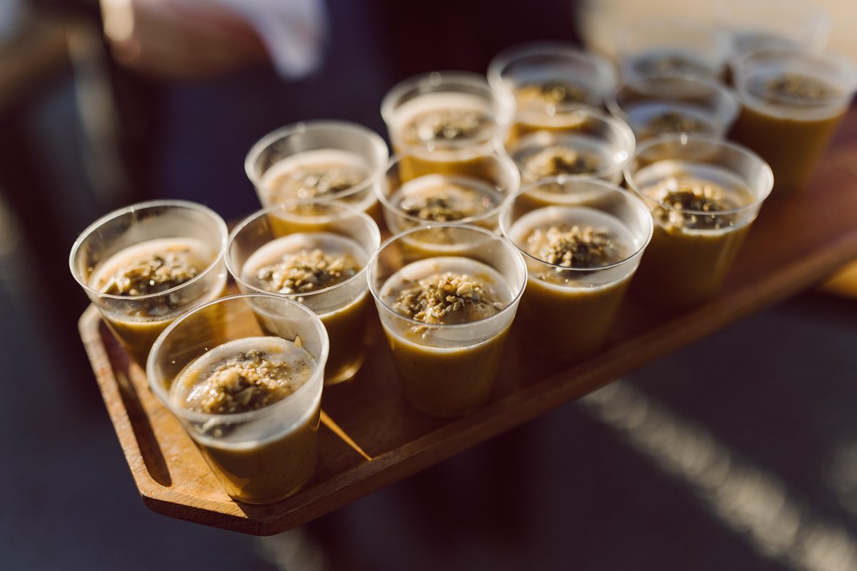 Talking about climate change (global warming) we've been having weirdly warm almost hot Fall. So we were hoping so another warm day for Becca and Dan's wedding on October 8, 2022 but unfortunately non of us were that lucky and it was pretty chilly. Especially at The Farm at Glenwood Mountain NJ which is pretty Northern NJ it felt or was colder, windier and just chillier. Thankfully I brought the right jacket for the chilly wind on the top of Glenwood Mountain but OMG I felt so bad for my bride Becca only wearing her lace wedding dress standing outside on top of Glenwood Mountain during the wedding ceremony. But before I talk about the wedding ceremony let's start from Becca and Dan's wedding prep which took place onsite at The Farm at Glenwood Mountain in Sussex NJ. Becca got ready cozy in the bridal suit when Dan just got ready by the Barn at The Farm at Glenwood Mountain and we went straight into Becca and Dan's first look next to the Highland Cows! Cutest fluffy Highland Cows were all out by the field and chilled while we took some wedding portraits of Becca and Dan. One of the many reasons "I LOVE" this wedding venue "The Farm at Glenwood Mountain" is because of these adorable Fluffy Cows called Highland Cows! I can stare at the all day long and take photo of them all day long. After Becca and Dan's first look, wedding portraits and family photos were done I walked up to the hill to Becca and Dan's outdoor ceremony area on top of the hill at The Farm at Glenwood Mountain and along the way I saw more cute baby Highland Cows to photograph and stare and wave hello. Watched guests arrive in a Yellow School bus in any rustic Farm wedding style and was them walk up the hill. Following the path, the fence with The Barn at their backdrop. Sun was out, it was clear gorgeous day but bit chilly and definitely way windy on top of the hill. My groom Dan came up along with their dog Dash (Dasher), then finally Becca arrived with her parents along side her. Ceremony started quickly knowing that guests and bride probably are freezing, Wind kept moving the cloud in and out making me change my exposure non stop. Wind blew hard, moving Becca's hair all over the place. But non the less it was sincere and beautiful wedding ceremony surrounded by nature, trees and Highland Cows Becca and Dan said their wedding vows followed by I do's. Sealing the wedding ceremony with a kiss Becca and Dan walked down the aisle quickly as possible to bundle Becca in to something warm. Amazing food, spread and hors d'oeuvres were passed out and when the sun was setting everyone made their way in to the barn for warmth and to seated for Becca and Dan's wedding reception. Gorgeous structured barn at The Farm at Glenwood Mountain is definitely not your typical too rustic and broken down barn, the barn here is new, clean, architectural and gorgeous! The owner Chef Steve even makes everyone take off their shoes if we need to enter the barn before the reception. Just like that Becca and Dan danced and partied their way into the night and it was already time for their barn fire and s'mores time outside. Becca and Dan's The Farm at Glenwood Mountain Sussex NJ wedding captured by Karis from Hey Karis New York, Brooklyn, Hudson Valley and Catskills Wedding Photographer and NYC Elopement Photographer.
