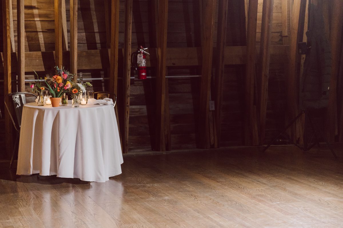 Talking about climate change (global warming) we've been having weirdly warm almost hot Fall. So we were hoping so another warm day for Becca and Dan's wedding on October 8, 2022 but unfortunately non of us were that lucky and it was pretty chilly. Especially at The Farm at Glenwood Mountain NJ which is pretty Northern NJ it felt or was colder, windier and just chillier. Thankfully I brought the right jacket for the chilly wind on the top of Glenwood Mountain but OMG I felt so bad for my bride Becca only wearing her lace wedding dress standing outside on top of Glenwood Mountain during the wedding ceremony. But before I talk about the wedding ceremony let's start from Becca and Dan's wedding prep which took place onsite at The Farm at Glenwood Mountain in Sussex NJ. Becca got ready cozy in the bridal suit when Dan just got ready by the Barn at The Farm at Glenwood Mountain and we went straight into Becca and Dan's first look next to the Highland Cows! Cutest fluffy Highland Cows were all out by the field and chilled while we took some wedding portraits of Becca and Dan. One of the many reasons "I LOVE" this wedding venue "The Farm at Glenwood Mountain" is because of these adorable Fluffy Cows called Highland Cows! I can stare at the all day long and take photo of them all day long. After Becca and Dan's first look, wedding portraits and family photos were done I walked up to the hill to Becca and Dan's outdoor ceremony area on top of the hill at The Farm at Glenwood Mountain and along the way I saw more cute baby Highland Cows to photograph and stare and wave hello. Watched guests arrive in a Yellow School bus in any rustic Farm wedding style and was them walk up the hill. Following the path, the fence with The Barn at their backdrop. Sun was out, it was clear gorgeous day but bit chilly and definitely way windy on top of the hill. My groom Dan came up along with their dog Dash (Dasher), then finally Becca arrived with her parents along side her. Ceremony started quickly knowing that guests and bride probably are freezing, Wind kept moving the cloud in and out making me change my exposure non stop. Wind blew hard, moving Becca's hair all over the place. But non the less it was sincere and beautiful wedding ceremony surrounded by nature, trees and Highland Cows Becca and Dan said their wedding vows followed by I do's. Sealing the wedding ceremony with a kiss Becca and Dan walked down the aisle quickly as possible to bundle Becca in to something warm. Amazing food, spread and hors d'oeuvres were passed out and when the sun was setting everyone made their way in to the barn for warmth and to seated for Becca and Dan's wedding reception. Gorgeous structured barn at The Farm at Glenwood Mountain is definitely not your typical too rustic and broken down barn, the barn here is new, clean, architectural and gorgeous! The owner Chef Steve even makes everyone take off their shoes if we need to enter the barn before the reception. Just like that Becca and Dan danced and partied their way into the night and it was already time for their barn fire and s'mores time outside. Becca and Dan's The Farm at Glenwood Mountain Sussex NJ wedding captured by Karis from Hey Karis New York, Brooklyn, Hudson Valley and Catskills Wedding Photographer and NYC Elopement Photographer.
