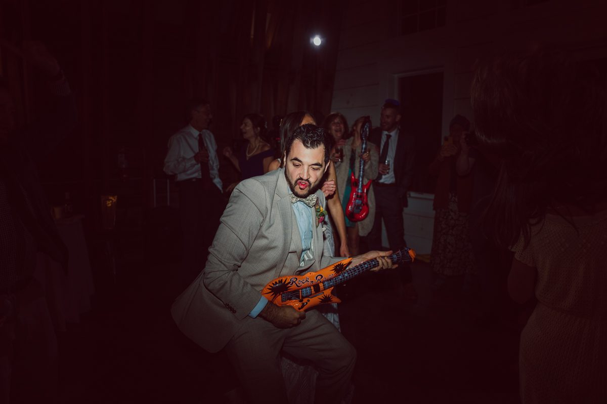 Talking about climate change (global warming) we've been having weirdly warm almost hot Fall. So we were hoping so another warm day for Becca and Dan's wedding on October 8, 2022 but unfortunately non of us were that lucky and it was pretty chilly. Especially at The Farm at Glenwood Mountain NJ which is pretty Northern NJ it felt or was colder, windier and just chillier. Thankfully I brought the right jacket for the chilly wind on the top of Glenwood Mountain but OMG I felt so bad for my bride Becca only wearing her lace wedding dress standing outside on top of Glenwood Mountain during the wedding ceremony. But before I talk about the wedding ceremony let's start from Becca and Dan's wedding prep which took place onsite at The Farm at Glenwood Mountain in Sussex NJ. Becca got ready cozy in the bridal suit when Dan just got ready by the Barn at The Farm at Glenwood Mountain and we went straight into Becca and Dan's first look next to the Highland Cows! Cutest fluffy Highland Cows were all out by the field and chilled while we took some wedding portraits of Becca and Dan. One of the many reasons "I LOVE" this wedding venue "The Farm at Glenwood Mountain" is because of these adorable Fluffy Cows called Highland Cows! I can stare at the all day long and take photo of them all day long. After Becca and Dan's first look, wedding portraits and family photos were done I walked up to the hill to Becca and Dan's outdoor ceremony area on top of the hill at The Farm at Glenwood Mountain and along the way I saw more cute baby Highland Cows to photograph and stare and wave hello. Watched guests arrive in a Yellow School bus in any rustic Farm wedding style and was them walk up the hill. Following the path, the fence with The Barn at their backdrop. Sun was out, it was clear gorgeous day but bit chilly and definitely way windy on top of the hill. My groom Dan came up along with their dog Dash (Dasher), then finally Becca arrived with her parents along side her. Ceremony started quickly knowing that guests and bride probably are freezing, Wind kept moving the cloud in and out making me change my exposure non stop. Wind blew hard, moving Becca's hair all over the place. But non the less it was sincere and beautiful wedding ceremony surrounded by nature, trees and Highland Cows Becca and Dan said their wedding vows followed by I do's. Sealing the wedding ceremony with a kiss Becca and Dan walked down the aisle quickly as possible to bundle Becca in to something warm. Amazing food, spread and hors d'oeuvres were passed out and when the sun was setting everyone made their way in to the barn for warmth and to seated for Becca and Dan's wedding reception. Gorgeous structured barn at The Farm at Glenwood Mountain is definitely not your typical too rustic and broken down barn, the barn here is new, clean, architectural and gorgeous! The owner Chef Steve even makes everyone take off their shoes if we need to enter the barn before the reception. Just like that Becca and Dan danced and partied their way into the night and it was already time for their barn fire and s'mores time outside. Becca and Dan's The Farm at Glenwood Mountain Sussex NJ wedding captured by Karis from Hey Karis New York, Brooklyn, Hudson Valley and Catskills Wedding Photographer and NYC Elopement Photographer.
