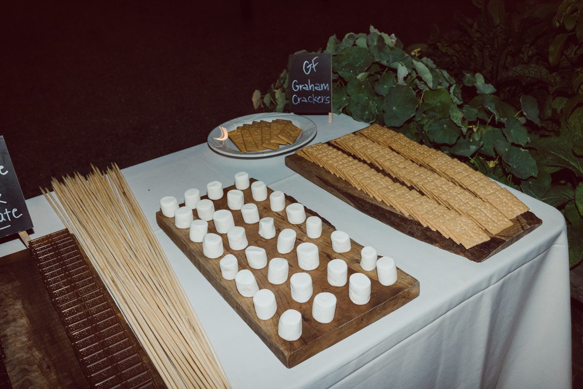Talking about climate change (global warming) we've been having weirdly warm almost hot Fall. So we were hoping so another warm day for Becca and Dan's wedding on October 8, 2022 but unfortunately non of us were that lucky and it was pretty chilly. Especially at The Farm at Glenwood Mountain NJ which is pretty Northern NJ it felt or was colder, windier and just chillier. Thankfully I brought the right jacket for the chilly wind on the top of Glenwood Mountain but OMG I felt so bad for my bride Becca only wearing her lace wedding dress standing outside on top of Glenwood Mountain during the wedding ceremony. But before I talk about the wedding ceremony let's start from Becca and Dan's wedding prep which took place onsite at The Farm at Glenwood Mountain in Sussex NJ. Becca got ready cozy in the bridal suit when Dan just got ready by the Barn at The Farm at Glenwood Mountain and we went straight into Becca and Dan's first look next to the Highland Cows! Cutest fluffy Highland Cows were all out by the field and chilled while we took some wedding portraits of Becca and Dan. One of the many reasons "I LOVE" this wedding venue "The Farm at Glenwood Mountain" is because of these adorable Fluffy Cows called Highland Cows! I can stare at the all day long and take photo of them all day long. After Becca and Dan's first look, wedding portraits and family photos were done I walked up to the hill to Becca and Dan's outdoor ceremony area on top of the hill at The Farm at Glenwood Mountain and along the way I saw more cute baby Highland Cows to photograph and stare and wave hello. Watched guests arrive in a Yellow School bus in any rustic Farm wedding style and was them walk up the hill. Following the path, the fence with The Barn at their backdrop. Sun was out, it was clear gorgeous day but bit chilly and definitely way windy on top of the hill. My groom Dan came up along with their dog Dash (Dasher), then finally Becca arrived with her parents along side her. Ceremony started quickly knowing that guests and bride probably are freezing, Wind kept moving the cloud in and out making me change my exposure non stop. Wind blew hard, moving Becca's hair all over the place. But non the less it was sincere and beautiful wedding ceremony surrounded by nature, trees and Highland Cows Becca and Dan said their wedding vows followed by I do's. Sealing the wedding ceremony with a kiss Becca and Dan walked down the aisle quickly as possible to bundle Becca in to something warm. Amazing food, spread and hors d'oeuvres were passed out and when the sun was setting everyone made their way in to the barn for warmth and to seated for Becca and Dan's wedding reception. Gorgeous structured barn at The Farm at Glenwood Mountain is definitely not your typical too rustic and broken down barn, the barn here is new, clean, architectural and gorgeous! The owner Chef Steve even makes everyone take off their shoes if we need to enter the barn before the reception. Just like that Becca and Dan danced and partied their way into the night and it was already time for their barn fire and s'mores time outside. Becca and Dan's The Farm at Glenwood Mountain Sussex NJ wedding captured by Karis from Hey Karis New York, Brooklyn, Hudson Valley and Catskills Wedding Photographer and NYC Elopement Photographer.
