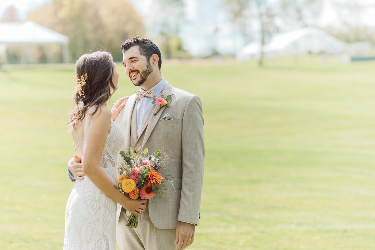 Talking about climate change (global warming) we've been having weirdly warm almost hot Fall. So we were hoping so another warm day for Becca and Dan's wedding on October 8, 2022 but unfortunately non of us were that lucky and it was pretty chilly. Especially at The Farm at Glenwood Mountain NJ which is pretty Northern NJ it felt or was colder, windier and just chillier. Thankfully I brought the right jacket for the chilly wind on the top of Glenwood Mountain but OMG I felt so bad for my bride Becca only wearing her lace wedding dress standing outside on top of Glenwood Mountain during the wedding ceremony. But before I talk about the wedding ceremony let's start from Becca and Dan's wedding prep which took place onsite at The Farm at Glenwood Mountain in Sussex NJ. Becca got ready cozy in the bridal suit when Dan just got ready by the Barn at The Farm at Glenwood Mountain and we went straight into Becca and Dan's first look next to the Highland Cows! Cutest fluffy Highland Cows were all out by the field and chilled while we took some wedding portraits of Becca and Dan. One of the many reasons "I LOVE" this wedding venue "The Farm at Glenwood Mountain" is because of these adorable Fluffy Cows called Highland Cows! I can stare at the all day long and take photo of them all day long. After Becca and Dan's first look, wedding portraits and family photos were done I walked up to the hill to Becca and Dan's outdoor ceremony area on top of the hill at The Farm at Glenwood Mountain and along the way I saw more cute baby Highland Cows to photograph and stare and wave hello. Watched guests arrive in a Yellow School bus in any rustic Farm wedding style and was them walk up the hill. Following the path, the fence with The Barn at their backdrop. Sun was out, it was clear gorgeous day but bit chilly and definitely way windy on top of the hill. My groom Dan came up along with their dog Dash (Dasher), then finally Becca arrived with her parents along side her. Ceremony started quickly knowing that guests and bride probably are freezing, Wind kept moving the cloud in and out making me change my exposure non stop. Wind blew hard, moving Becca's hair all over the place. But non the less it was sincere and beautiful wedding ceremony surrounded by nature, trees and Highland Cows Becca and Dan said their wedding vows followed by I do's. Sealing the wedding ceremony with a kiss Becca and Dan walked down the aisle quickly as possible to bundle Becca in to something warm. Amazing food, spread and hors d'oeuvres were passed out and when the sun was setting everyone made their way in to the barn for warmth and to seated for Becca and Dan's wedding reception. Gorgeous structured barn at The Farm at Glenwood Mountain is definitely not your typical too rustic and broken down barn, the barn here is new, clean, architectural and gorgeous! The owner Chef Steve even makes everyone take off their shoes if we need to enter the barn before the reception. Just like that Becca and Dan danced and partied their way into the night and it was already time for their barn fire and s'mores time outside. Becca and Dan's The Farm at Glenwood Mountain Sussex NJ wedding captured by Karis from Hey Karis New York, Brooklyn, Hudson Valley and Catskills Wedding Photographer and NYC Elopement Photographer.

