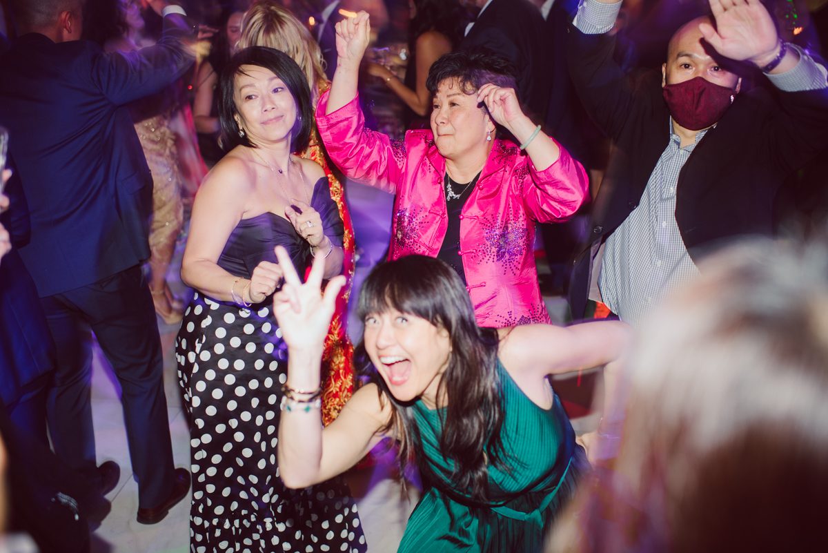 Connie and Richard who are Rick's parents inquired for their son's wedding since his son Rick and soon to be daughter in law currently lives in California and was planning their wedding in the West Coast. Connie and Richard are from here in NJ and was eager to help and plan their son's wedding here in the East Coast. Connie and Richard chose Crystal Plaza in Livingston NJ for their son's wedding venue here in NJ on October 29, 2022. Connie and Richard were delightful parents and young minded for first generation Chinese Americans, their english was fluent as well as their Chinese I was pleasantly surprised since I am second generation Korean-American and my immigrant Korean parents do not speak english that well. It was my first wedding where I did not get to meet the bride and groom till the wedding day. It made me bit nervous as I walked into the bridal suite at Crystal Plaza. But to my surprise Alison and Rick were super sweet and nice where we smoothly worked through the portrait session. Alison and Rick followed all my directions well, did everything I asked them to then it was time for PARTY! Cocktail hour at Crystal Plaza was impressive with spreads and tables of delicious food! I definitely enjoyed some of the delicious food during cocktail hour then walked into the reception room and i was WOWed. The house lights at Crystal Plaza was beautiful and it was actually amazing that I didn't even use my own lights. The mixture of house lights, fog and spotlights at Crystal Plaza was actually fabulous and I was very impressed. The house lights at Crystal Plaza made shutter drag dancing photos with double exposure so much fun and amazing! Alison and Rick, actually Connie and Richard even hired Chinese Lion Dancers for the reception and all the guests loved it. The energy during Alison and Rick's wedding reception was on FIRE! Everyone and anyone was on the dance floor dancing like it was their last one. I truly had a blast during Alison and Rick's wedding at Crystal Plaza in Livingston NJ and looking forward to going back to Crystal Plaza soon. Alison and Rick's Crystal Plaza in Livingston NJ wedding captured by Karis from Hey Karis New York, Brooklyn, Hudson Valley and Catskills Wedding Photographer and NYC Elopement Photographer.