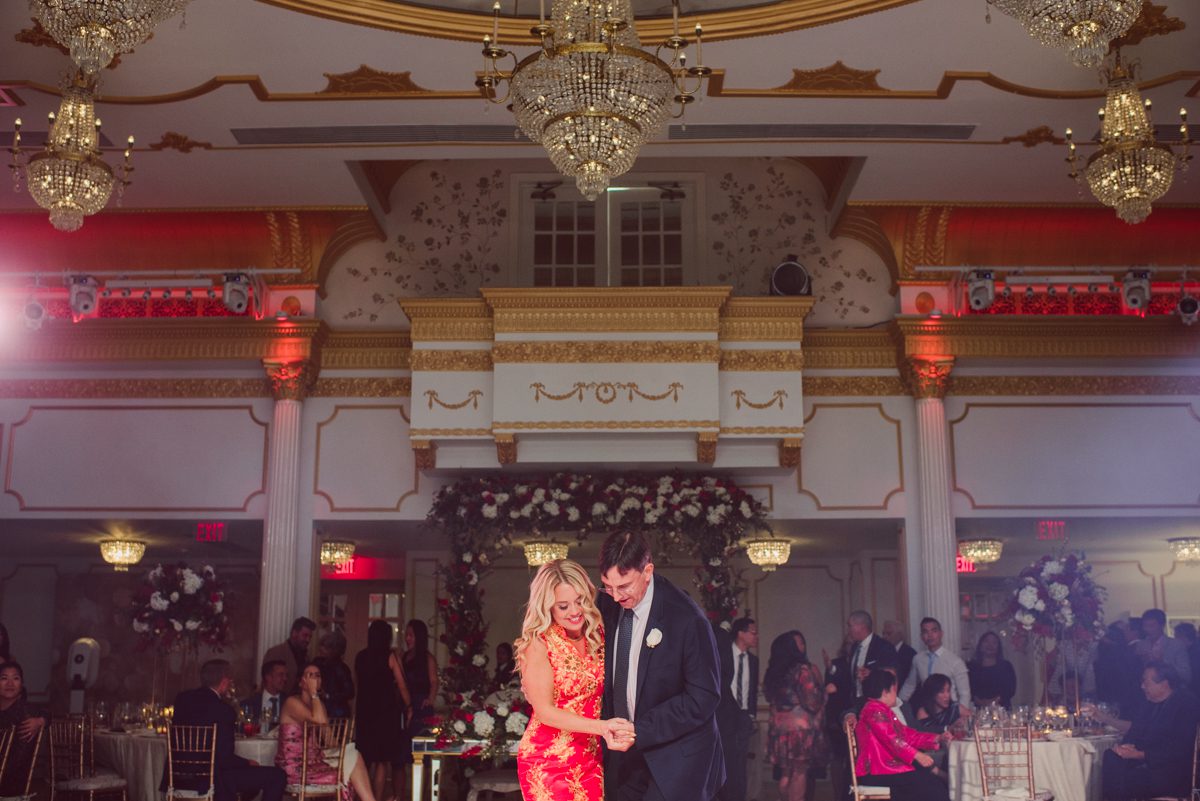 Connie and Richard who are Rick's parents inquired for their son's wedding since his son Rick and soon to be daughter in law currently lives in California and was planning their wedding in the West Coast. Connie and Richard are from here in NJ and was eager to help and plan their son's wedding here in the East Coast. Connie and Richard chose Crystal Plaza in Livingston NJ for their son's wedding venue here in NJ on October 29, 2022. Connie and Richard were delightful parents and young minded for first generation Chinese Americans, their english was fluent as well as their Chinese I was pleasantly surprised since I am second generation Korean-American and my immigrant Korean parents do not speak english that well. It was my first wedding where I did not get to meet the bride and groom till the wedding day. It made me bit nervous as I walked into the bridal suite at Crystal Plaza. But to my surprise Alison and Rick were super sweet and nice where we smoothly worked through the portrait session. Alison and Rick followed all my directions well, did everything I asked them to then it was time for PARTY! Cocktail hour at Crystal Plaza was impressive with spreads and tables of delicious food! I definitely enjoyed some of the delicious food during cocktail hour then walked into the reception room and i was WOWed. The house lights at Crystal Plaza was beautiful and it was actually amazing that I didn't even use my own lights. The mixture of house lights, fog and spotlights at Crystal Plaza was actually fabulous and I was very impressed. The house lights at Crystal Plaza made shutter drag dancing photos with double exposure so much fun and amazing! Alison and Rick, actually Connie and Richard even hired Chinese Lion Dancers for the reception and all the guests loved it. The energy during Alison and Rick's wedding reception was on FIRE! Everyone and anyone was on the dance floor dancing like it was their last one. I truly had a blast during Alison and Rick's wedding at Crystal Plaza in Livingston NJ and looking forward to going back to Crystal Plaza soon. Alison and Rick's Crystal Plaza in Livingston NJ wedding captured by Karis from Hey Karis New York, Brooklyn, Hudson Valley and Catskills Wedding Photographer and NYC Elopement Photographer.