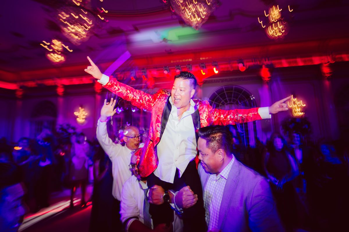 Connie and Richard who are Rick's parents inquired for their son's wedding since his son Rick and soon to be daughter in law currently lives in California and was planning their wedding in the West Coast. Connie and Richard are from here in NJ and was eager to help and plan their son's wedding here in the East Coast. Connie and Richard chose Crystal Plaza in Livingston NJ for their son's wedding venue here in NJ on October 29, 2022. Connie and Richard were delightful parents and young minded for first generation Chinese Americans, their english was fluent as well as their Chinese I was pleasantly surprised since I am second generation Korean-American and my immigrant Korean parents do not speak english that well. It was my first wedding where I did not get to meet the bride and groom till the wedding day. It made me bit nervous as I walked into the bridal suite at Crystal Plaza. But to my surprise Alison and Rick were super sweet and nice where we smoothly worked through the portrait session. Alison and Rick followed all my directions well, did everything I asked them to then it was time for PARTY! Cocktail hour at Crystal Plaza was impressive with spreads and tables of delicious food! I definitely enjoyed some of the delicious food during cocktail hour then walked into the reception room and i was WOWed. The house lights at Crystal Plaza was beautiful and it was actually amazing that I didn't even use my own lights. The mixture of house lights, fog and spotlights at Crystal Plaza was actually fabulous and I was very impressed. The house lights at Crystal Plaza made shutter drag dancing photos with double exposure so much fun and amazing! Alison and Rick, actually Connie and Richard even hired Chinese Lion Dancers for the reception and all the guests loved it. The energy during Alison and Rick's wedding reception was on FIRE! Everyone and anyone was on the dance floor dancing like it was their last one. I truly had a blast during Alison and Rick's wedding at Crystal Plaza in Livingston NJ and looking forward to going back to Crystal Plaza soon. Alison and Rick's Crystal Plaza in Livingston NJ wedding captured by Karis from Hey Karis New York, Brooklyn, Hudson Valley and Catskills Wedding Photographer and NYC Elopement Photographer.