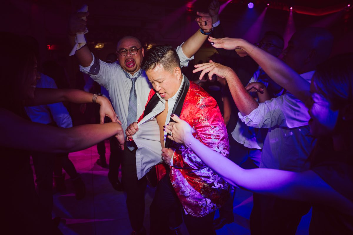 Connie and Richard who are Rick's parents inquired for their son's wedding since his son Rick and soon to be daughter in law currently lives in California and was planning their wedding in the West Coast. Connie and Richard are from here in NJ and was eager to help and plan their son's wedding here in the East Coast. Connie and Richard chose Crystal Plaza in Livingston NJ for their son's wedding venue here in NJ on October 29, 2022. Connie and Richard were delightful parents and young minded for first generation Chinese Americans, their english was fluent as well as their Chinese I was pleasantly surprised since I am second generation Korean-American and my immigrant Korean parents do not speak english that well. It was my first wedding where I did not get to meet the bride and groom till the wedding day. It made me bit nervous as I walked into the bridal suite at Crystal Plaza. But to my surprise Alison and Rick were super sweet and nice where we smoothly worked through the portrait session. Alison and Rick followed all my directions well, did everything I asked them to then it was time for PARTY! Cocktail hour at Crystal Plaza was impressive with spreads and tables of delicious food! I definitely enjoyed some of the delicious food during cocktail hour then walked into the reception room and i was WOWed. The house lights at Crystal Plaza was beautiful and it was actually amazing that I didn't even use my own lights. The mixture of house lights, fog and spotlights at Crystal Plaza was actually fabulous and I was very impressed. The house lights at Crystal Plaza made shutter drag dancing photos with double exposure so much fun and amazing! Alison and Rick, actually Connie and Richard even hired Chinese Lion Dancers for the reception and all the guests loved it. The energy during Alison and Rick's wedding reception was on FIRE! Everyone and anyone was on the dance floor dancing like it was their last one. I truly had a blast during Alison and Rick's wedding at Crystal Plaza in Livingston NJ and looking forward to going back to Crystal Plaza soon. Alison and Rick's Crystal Plaza in Livingston NJ wedding captured by Karis from Hey Karis New York, Brooklyn, Hudson Valley and Catskills Wedding Photographer and NYC Elopement Photographer.