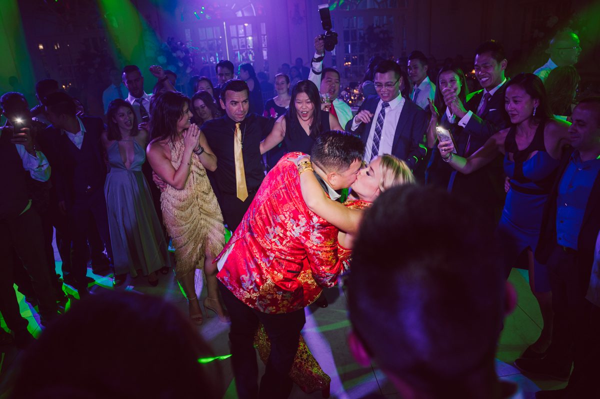 Connie and Richard who are Rick's parents inquired for their son's wedding since his son Rick and soon to be daughter in law currently lives in California and was planning their wedding in the West Coast. Connie and Richard are from here in NJ and was eager to help and plan their son's wedding here in the East Coast. Connie and Richard chose Crystal Plaza in Livingston NJ for their son's wedding venue here in NJ on October 29, 2022. Connie and Richard were delightful parents and young minded for first generation Chinese Americans, their english was fluent as well as their Chinese I was pleasantly surprised since I am second generation Korean-American and my immigrant Korean parents do not speak english that well. It was my first wedding where I did not get to meet the bride and groom till the wedding day. It made me bit nervous as I walked into the bridal suite at Crystal Plaza. But to my surprise Alison and Rick were super sweet and nice where we smoothly worked through the portrait session. Alison and Rick followed all my directions well, did everything I asked them to then it was time for PARTY! Cocktail hour at Crystal Plaza was impressive with spreads and tables of delicious food! I definitely enjoyed some of the delicious food during cocktail hour then walked into the reception room and i was WOWed. The house lights at Crystal Plaza was beautiful and it was actually amazing that I didn't even use my own lights. The mixture of house lights, fog and spotlights at Crystal Plaza was actually fabulous and I was very impressed. The house lights at Crystal Plaza made shutter drag dancing photos with double exposure so much fun and amazing! Alison and Rick, actually Connie and Richard even hired Chinese Lion Dancers for the reception and all the guests loved it. The energy during Alison and Rick's wedding reception was on FIRE! Everyone and anyone was on the dance floor dancing like it was their last one. I truly had a blast during Alison and Rick's wedding at Crystal Plaza in Livingston NJ and looking forward to going back to Crystal Plaza soon. Alison and Rick's Crystal Plaza in Livingston NJ wedding captured by Karis from Hey Karis New York, Brooklyn, Hudson Valley and Catskills Wedding Photographer and NYC Elopement Photographer.