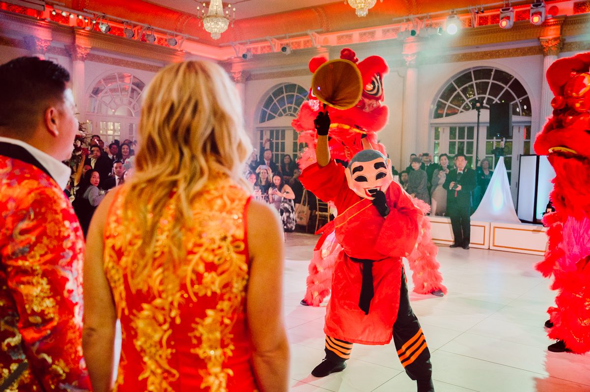 Connie and Richard who are Rick's parents inquired for their son's wedding since his son Rick and soon to be daughter in law currently lives in California and was planning their wedding in the West Coast. Connie and Richard are from here in NJ and was eager to help and plan their son's wedding here in the East Coast. Connie and Richard chose Crystal Plaza in Livingston NJ for their son's wedding venue here in NJ on October 29, 2022. Connie and Richard were delightful parents and young minded for first generation Chinese Americans, their english was fluent as well as their Chinese I was pleasantly surprised since I am second generation Korean-American and my immigrant Korean parents do not speak english that well. It was my first wedding where I did not get to meet the bride and groom till the wedding day. It made me bit nervous as I walked into the bridal suite at Crystal Plaza. But to my surprise Alison and Rick were super sweet and nice where we smoothly worked through the portrait session. Alison and Rick followed all my directions well, did everything I asked them to then it was time for PARTY! Cocktail hour at Crystal Plaza was impressive with spreads and tables of delicious food! I definitely enjoyed some of the delicious food during cocktail hour then walked into the reception room and i was WOWed. The house lights at Crystal Plaza was beautiful and it was actually amazing that I didn't even use my own lights. The mixture of house lights, fog and spotlights at Crystal Plaza was actually fabulous and I was very impressed. The house lights at Crystal Plaza made shutter drag dancing photos with double exposure so much fun and amazing! Alison and Rick, actually Connie and Richard even hired Chinese Lion Dancers for the reception and all the guests loved it. The energy during Alison and Rick's wedding reception was on FIRE! Everyone and anyone was on the dance floor dancing like it was their last one. I truly had a blast during Alison and Rick's wedding at Crystal Plaza in Livingston NJ and looking forward to going back to Crystal Plaza soon. Alison and Rick's Crystal Plaza in Livingston NJ wedding captured by Karis from Hey Karis New York, Brooklyn, Hudson Valley and Catskills Wedding Photographer and NYC Elopement Photographer.