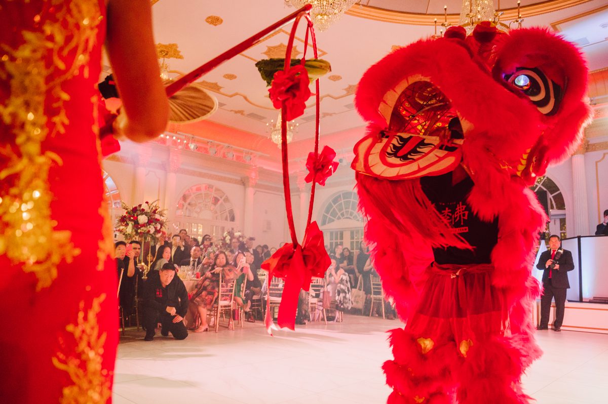 Connie and Richard who are Rick's parents inquired for their son's wedding since his son Rick and soon to be daughter in law currently lives in California and was planning their wedding in the West Coast. Connie and Richard are from here in NJ and was eager to help and plan their son's wedding here in the East Coast. Connie and Richard chose Crystal Plaza in Livingston NJ for their son's wedding venue here in NJ on October 29, 2022. Connie and Richard were delightful parents and young minded for first generation Chinese Americans, their english was fluent as well as their Chinese I was pleasantly surprised since I am second generation Korean-American and my immigrant Korean parents do not speak english that well. It was my first wedding where I did not get to meet the bride and groom till the wedding day. It made me bit nervous as I walked into the bridal suite at Crystal Plaza. But to my surprise Alison and Rick were super sweet and nice where we smoothly worked through the portrait session. Alison and Rick followed all my directions well, did everything I asked them to then it was time for PARTY! Cocktail hour at Crystal Plaza was impressive with spreads and tables of delicious food! I definitely enjoyed some of the delicious food during cocktail hour then walked into the reception room and i was WOWed. The house lights at Crystal Plaza was beautiful and it was actually amazing that I didn't even use my own lights. The mixture of house lights, fog and spotlights at Crystal Plaza was actually fabulous and I was very impressed. The house lights at Crystal Plaza made shutter drag dancing photos with double exposure so much fun and amazing! Alison and Rick, actually Connie and Richard even hired Chinese Lion Dancers for the reception and all the guests loved it. The energy during Alison and Rick's wedding reception was on FIRE! Everyone and anyone was on the dance floor dancing like it was their last one. I truly had a blast during Alison and Rick's wedding at Crystal Plaza in Livingston NJ and looking forward to going back to Crystal Plaza soon. Alison and Rick's Crystal Plaza in Livingston NJ wedding captured by Karis from Hey Karis New York, Brooklyn, Hudson Valley and Catskills Wedding Photographer and NYC Elopement Photographer.