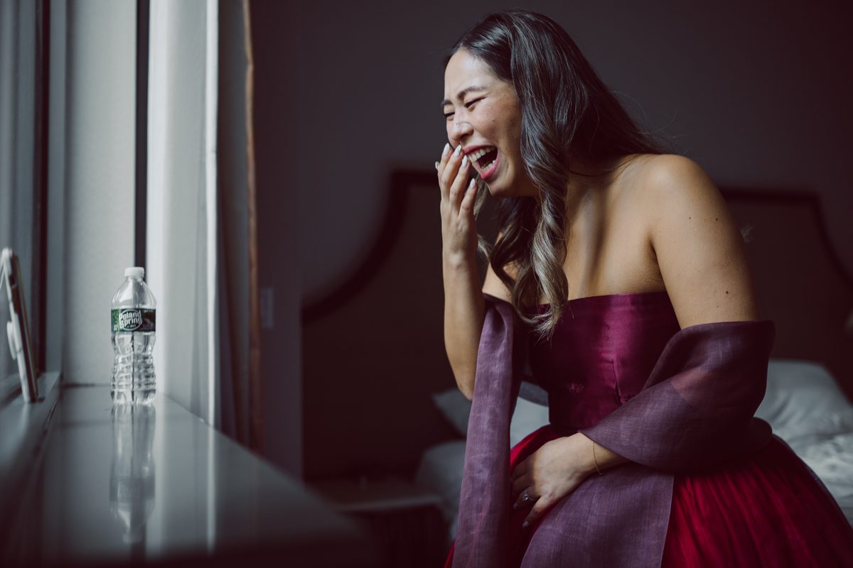 Duffield St, Brooklyn on November 19 even though it's Saturday morning it was still very busy. But luckily I found street parking right on Duffield St in front of Sheraton Downtown Brooklyn which was where I needed to be for Ariana and Jon's wedding prep. Vicky from VickyC5 hair/makeup team was there beautifying the ladies, I went straight to flat lays of Ariana's wedding details such as rings, jewelry and her wedding invitations. I use ribbons, extra loose flowers to make the flat lays more fine art looking. Once all the details are done, my full focus goes to the bride Ariana and her ladies. Ariana and Jon were planning to do a Chinese Door Game at the hotel room, so as soon as Ariana was ready in her Hanbok (Korean Traditional Wedding Outfit) Jon and his groomsmen arrived at the door. With Ariana's bridal suite crowded with too many people Ariana's bridesmaids started to give instructions to the games that Jon and his groomsmen need to play in order to get through the second door so that Jon can meet/see his bride Ariana. While the games are happening outside Ariana's door one of the bridesmaid has her phone on FaceTime so that Ariana can see how the men are doing during all the door games. I of course had my second shooter inside the room with Ariana to get her reactions which was hilarious. After the door games, we then moved to a conference room of at Sheraton Downtown Brooklyn for Ariana and Jon's Chinese Tea Pouring Ceremony (this is Jon's Chinese side's wedding tradition where you pour tea to all the elders in the family). Once all the Chines and Korean wedding traditions are over, we all rushed to Brooklyn Botanical Garden. Traffic from Sheraton Downtown Brooklyn to Brooklyn Botanical Garden was pretty bad, as usual. Once I arrived there of course was no street parking available near the entrance and parking lot for Brooklyn Botanical Garden was way too far for me to carry all the gears. After driving around I found one spot few blocks away from the Brooklyn Botanical Garden entrance. Brooklyn Botanical Garden was busy with Lightscape preparation and installation which we were not allowed to photograph so we were left with very little options for wedding portrait backdrop, plus it was COLD and we were looking light! These are important things to consider when you are planning for Winter wedding. I worked as quickly as possible with Ariana and Jon's first look and bridal party photos. Then we stayed inside for family photos since elders did not wanted to go outside which I totally don't blame. Then I quickly took Ariana and Jon outside for bit more couple's portraits then it was time for the wedding ceremony. Ariana and Jon's wedding ceremony held place at The Palm House at Brooklyn Botanical Garden, but because it was an winter wedding we've lost all the light and I had to use my video lights but over all the ceremony was beautiful and Oh Fleur NYC did absolutely an amazing job with ceremony decor (floral/candles). The Palm House was empty again, OhfleurNYC as well as Brooklyn Botanical Garden staff were busy turning the room. Oh Fleur NYC's Jessica's talent was amazing her usage of floral, choice of colors and mixing the floral with tall candles were magical. Turned The Palm House into a beautiful and romantic garden. Warmth of candles, peach and pinks of flowers all blended so well turning the Palm House at Brooklyn Botanical Garden in to fairytale floral ballroom. Ariana and Jon attended cocktail enjoying their time with friends and family before their wedding reception at The Palm House. Ariana and Jon's wedding at The Palm House at Brooklyn Botanical Garden documented by Karis from Hey Karis New York, Brooklyn, Hudson Valley and Catskills Wedding Photographer and NYC Elopement Photographer.