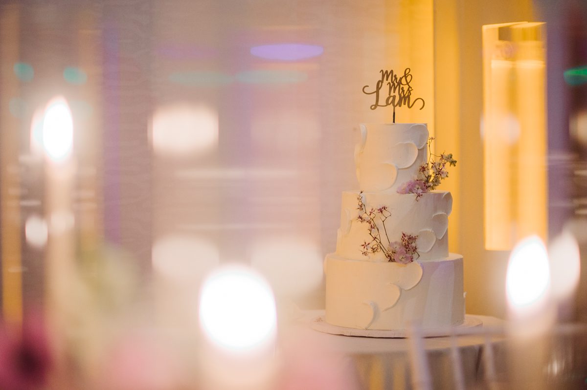 Duffield St, Brooklyn on November 19 even though it's Saturday morning it was still very busy. But luckily I found street parking right on Duffield St in front of Sheraton Downtown Brooklyn which was where I needed to be for Ariana and Jon's wedding prep. Vicky from VickyC5 hair/makeup team was there beautifying the ladies, I went straight to flat lays of Ariana's wedding details such as rings, jewelry and her wedding invitations. I use ribbons, extra loose flowers to make the flat lays more fine art looking. Once all the details are done, my full focus goes to the bride Ariana and her ladies. Ariana and Jon were planning to do a Chinese Door Game at the hotel room, so as soon as Ariana was ready in her Hanbok (Korean Traditional Wedding Outfit) Jon and his groomsmen arrived at the door. With Ariana's bridal suite crowded with too many people Ariana's bridesmaids started to give instructions to the games that Jon and his groomsmen need to play in order to get through the second door so that Jon can meet/see his bride Ariana. While the games are happening outside Ariana's door one of the bridesmaid has her phone on FaceTime so that Ariana can see how the men are doing during all the door games. I of course had my second shooter inside the room with Ariana to get her reactions which was hilarious. After the door games, we then moved to a conference room of at Sheraton Downtown Brooklyn for Ariana and Jon's Chinese Tea Pouring Ceremony (this is Jon's Chinese side's wedding tradition where you pour tea to all the elders in the family). Once all the Chines and Korean wedding traditions are over, we all rushed to Brooklyn Botanical Garden. Traffic from Sheraton Downtown Brooklyn to Brooklyn Botanical Garden was pretty bad, as usual. Once I arrived there of course was no street parking available near the entrance and parking lot for Brooklyn Botanical Garden was way too far for me to carry all the gears. After driving around I found one spot few blocks away from the Brooklyn Botanical Garden entrance. Brooklyn Botanical Garden was busy with Lightscape preparation and installation which we were not allowed to photograph so we were left with very little options for wedding portrait backdrop, plus it was COLD and we were looking light! These are important things to consider when you are planning for Winter wedding. I worked as quickly as possible with Ariana and Jon's first look and bridal party photos. Then we stayed inside for family photos since elders did not wanted to go outside which I totally don't blame. Then I quickly took Ariana and Jon outside for bit more couple's portraits then it was time for the wedding ceremony. Ariana and Jon's wedding ceremony held place at The Palm House at Brooklyn Botanical Garden, but because it was an winter wedding we've lost all the light and I had to use my video lights but over all the ceremony was beautiful and Oh Fleur NYC did absolutely an amazing job with ceremony decor (floral/candles). The Palm House was empty again, OhfleurNYC as well as Brooklyn Botanical Garden staff were busy turning the room. Oh Fleur NYC's Jessica's talent was amazing her usage of floral, choice of colors and mixing the floral with tall candles were magical. Turned The Palm House into a beautiful and romantic garden. Warmth of candles, peach and pinks of flowers all blended so well turning the Palm House at Brooklyn Botanical Garden in to fairytale floral ballroom. Ariana and Jon attended cocktail enjoying their time with friends and family before their wedding reception at The Palm House. Ariana and Jon's wedding at The Palm House at Brooklyn Botanical Garden documented by Karis from Hey Karis New York, Brooklyn, Hudson Valley and Catskills Wedding Photographer and NYC Elopement Photographer.