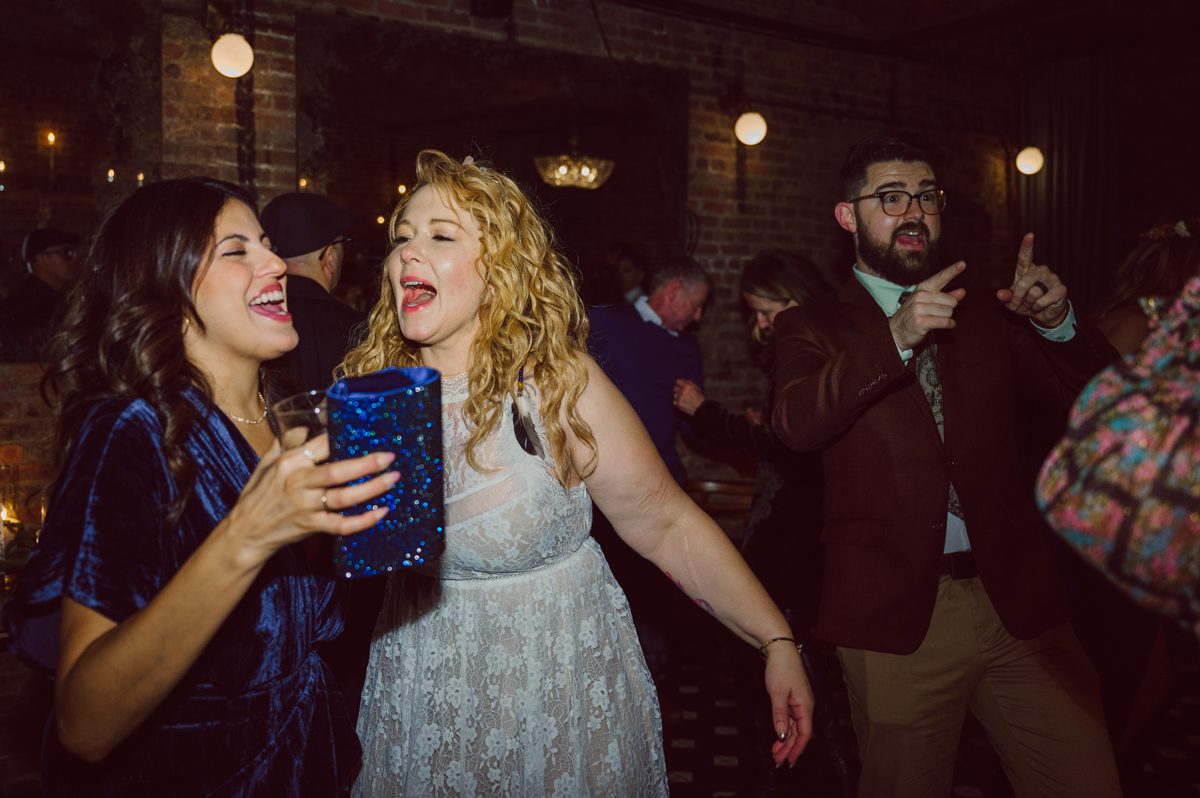 Since it was Friday and I did not wanted to get stuck in morning rush hour, I left for Brooklyn early! Friday December 2, I was on my way to document my last wedding of 2022 at Wythe Hotel in Brooklyn NY. I knew today was going to be great not just because I am photographing my last wedding of 2022 at Wythe Hotel in Brooklyn NY but because we are celebrating Jenny and Anderson two beautiful, pure and amazing human beings who are madly in love. Jenny is hairstylist for TV and Film where she gets to work with actors and actresses, she goes by JT Franchuk and some of her clients include Susan Sarandon in Maybe I do, Chloe Moretz in The Peripheral on Netflix as well as Halston also on Netflix. And Anderson is from Columbia, where he self taught himself during the pandemic and recently got a job at JP Morgan. These two amazingly talented and genuine lovers wedding day was finally here and I was here for all that they had planned for their wedding at Wythe Hotel Brooklyn NY. Jenny got ready at an airbnb on Vernon Ave and Anderson was getting a fresh cut at Cotter Barber Shop on Graham Ave. Jenny and Anderson's wedding day ran so smoothly due to amazing planner Cristina from Carismas Design. Jenny and Anderson's first look at Cooper Room at Wythe Hotel, then Jenny had her first look with her father and grandfather which was very emotional. The with Jenny and Anderson we walked around Wythe Hotel to do some more wedding portrait. Jenny and Anderson's cocktail hour was held at Pent House Loft/ Loft Room at Wythe Hotel then we all headed back down to Cooper Room Cellar for Jenny and Anderson's wedding reception. Jenny and Anderson's Wythe Hotel Brooklyn NY wedding documented by Karis from Hey Karis New York, Brooklyn, Hudson Valley and Catskills Wedding Photographer and NYC Elopement Photographer.