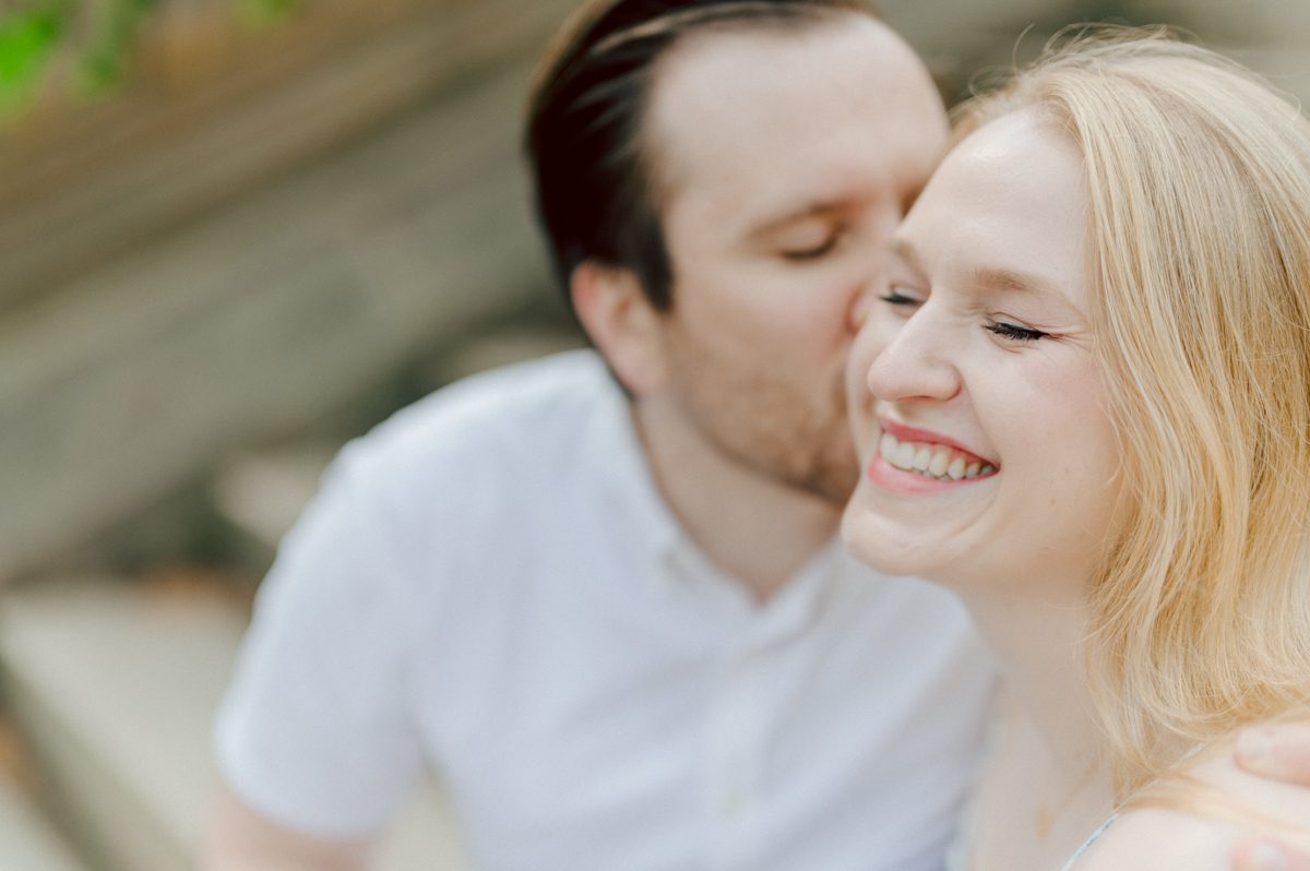 Off leash hour has officially started at Bethesda Fountain in Central Park NY, which is really the best time to go to Bethesda Fountain but only if you are a dog lover! There will be all kind of different personalities of dogs running wild around Bethesda Fountain off leash having the best time of their lives and I can sit there watching these adorable creatures all day long! But today I was there to photograph Katie and Craig and needed to stay focused. Katie and Craig were absolutely the best humans and fellow animal/nature lovers like me so we walked around and may have gotten lost in the woody forest of Central Park but this Central Park engagement session was bit different because Katie and Craig wanted to focus on the nature so we went looking for the lush greens and florals of Central Park. Bethesda Fountain Central Park NY engagement session documented by by Karis | Hey Karis | Catskills, Hudson Valley NY, elopement and wedding photographer | Brooklyn NY elopement and wedding photographer | Manhattan NY elopement and wedding photographer | Hey Karis is fun documentary wedding and elopement photographer.
