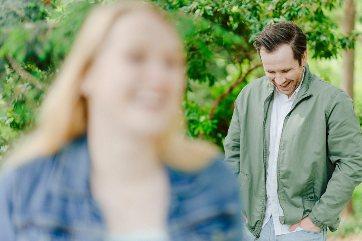 Off leash hour has officially started at Bethesda Fountain in Central Park NY, which is really the best time to go to Bethesda Fountain but only if you are a dog lover! There will be all kind of different personalities of dogs running wild around Bethesda Fountain off leash having the best time of their lives and I can sit there watching these adorable creatures all day long! But today I was there to photograph Katie and Craig and needed to stay focused. Katie and Craig were absolutely the best humans and fellow animal/nature lovers like me so we walked around and may have gotten lost in the woody forest of Central Park but this Central Park engagement session was bit different because Katie and Craig wanted to focus on the nature so we went looking for the lush greens and florals of Central Park. Bethesda Fountain Central Park NY engagement session documented by by Karis | Hey Karis | Catskills, Hudson Valley NY, elopement and wedding photographer | Brooklyn NY elopement and wedding photographer | Manhattan NY elopement and wedding photographer | Hey Karis is fun documentary wedding and elopement photographer.