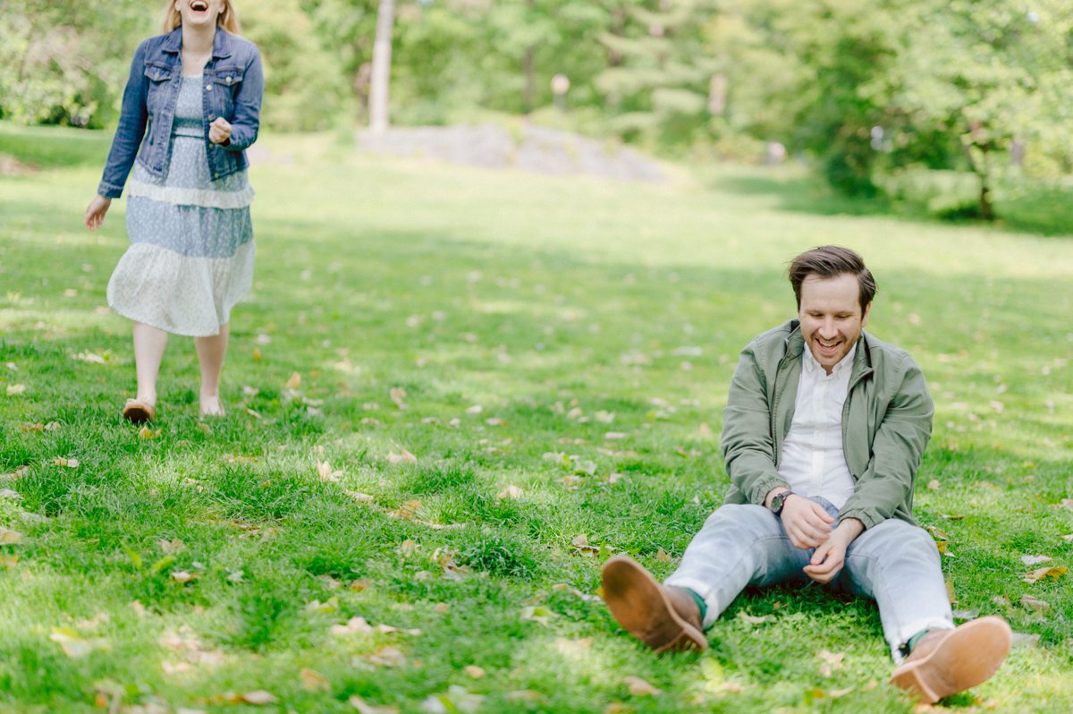 Off leash hour has officially started at Bethesda Fountain in Central Park NY, which is really the best time to go to Bethesda Fountain but only if you are a dog lover! There will be all kind of different personalities of dogs running wild around Bethesda Fountain off leash having the best time of their lives and I can sit there watching these adorable creatures all day long! But today I was there to photograph Katie and Craig and needed to stay focused. Katie and Craig were absolutely the best humans and fellow animal/nature lovers like me so we walked around and may have gotten lost in the woody forest of Central Park but this Central Park engagement session was bit different because Katie and Craig wanted to focus on the nature so we went looking for the lush greens and florals of Central Park. Bethesda Fountain Central Park NY engagement session documented by by Karis | Hey Karis | Catskills, Hudson Valley NY, elopement and wedding photographer | Brooklyn NY elopement and wedding photographer | Manhattan NY elopement and wedding photographer | Hey Karis is fun documentary wedding and elopement photographer.