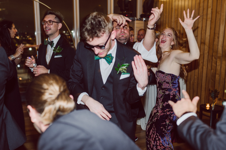 I've photographed multiple of Chris' best friends weddings several years ago. One couple at Tribeca Rooftop NY, another couple at Oheka Castle NY and few other friends at Long Island. So Chris knew when he was going to get married he would hire me. Few years later I get an email from Chris regarding his wedding. These are my dream ideal clients, because they know they will be hiring me even before they meet with me! After a quick phone call, Kaci and Chris booked and their engagement session date was set. We went to Orchard St in NYC where they used to live, walked around their old neighborhood while getting some engagement pics. Kaci and Chris' wedding at The Standard High Line, NY on April 22, 2023. It was raining for the whole week prior to Kaci and Chris wedding day making me bit worried but rain stopped on the morning of Kaci and Chris' wedding at The Standard High Line, NY. Kaci and Chris each got their own hotel rooms to get ready. With quite a big bridal party 10 bridesmaids and 10 groomsmen Kaci and Chris popped champagne bottles. With champagne glasses in their hands Kaci and her brides people laughed as they got their MUAH done by Face Time Beauty at The Standard High Line, NY. And Chris along with his groomsmen got ready in their very retro "Mad Men" vibe room fooling and goofing around till the ceremony at The Standard High Line, NY. Kaci and Chris wedding was held at The High Line Room and Terrace which overlooks The High Line, NY. Weather was gorgeous and I was excited to take Kaci and Chris to The High Line for their wedding portraits but unfortunately during their wedding ceremony at The High Line Room it started pouring! They say it's good luck when it rains on your wedding day, right! Unfortunately, going to The High Line for photos was no go, so backup was at The Terrace where the cocktail hour was going on and which was not even that big of a space. But with help of everyone I managed to get 22 people group photo done on The Terrace while the cocktail hour was going on and all the family formal photos as well as all the bridal party pairs. with only few minutes till Kaci and Chris' wedding reception at The High Line Room, we went up to The Top of Standard for Kaci and Chris' wedding portraits. Working super fast I managed to get good enough amount of wedding portraits of just Kaci and Chris. Music by Jack from LJDJ was playing, Kaci and Chris' wedding reception at The High Line Room at The Standard Hotel High Line NY was about to begin. Kaci and Chris' wedding reception at The Standard High Line was on fire from start to the last second of the evening. It was pouring outside, young people didn't seem to care it was raining and congregated the streets of Meatpacking District while I was weaving through the crowd of party goers to get home as quickly as possible. The night was just starting for them and I was ready for bed. Kaci and Chris' The High Line Room and Terrace, The Standard High Line, NY wedding documented by by Karis | Hey Karis | Catskills, Hudson Valley NY, elopement and wedding photographer | Brooklyn NY elopement and wedding photographer | Manhattan NY elopement and wedding photographer | Hey Karis is fun documentary wedding and elopement photographer.
