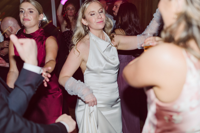 I've photographed multiple of Chris' best friends weddings several years ago. One couple at Tribeca Rooftop NY, another couple at Oheka Castle NY and few other friends at Long Island. So Chris knew when he was going to get married he would hire me. Few years later I get an email from Chris regarding his wedding. These are my dream ideal clients, because they know they will be hiring me even before they meet with me! After a quick phone call, Kaci and Chris booked and their engagement session date was set. We went to Orchard St in NYC where they used to live, walked around their old neighborhood while getting some engagement pics. Kaci and Chris' wedding at The Standard High Line, NY on April 22, 2023. It was raining for the whole week prior to Kaci and Chris wedding day making me bit worried but rain stopped on the morning of Kaci and Chris' wedding at The Standard High Line, NY. Kaci and Chris each got their own hotel rooms to get ready. With quite a big bridal party 10 bridesmaids and 10 groomsmen Kaci and Chris popped champagne bottles. With champagne glasses in their hands Kaci and her brides people laughed as they got their MUAH done by Face Time Beauty at The Standard High Line, NY. And Chris along with his groomsmen got ready in their very retro "Mad Men" vibe room fooling and goofing around till the ceremony at The Standard High Line, NY. Kaci and Chris wedding was held at The High Line Room and Terrace which overlooks The High Line, NY. Weather was gorgeous and I was excited to take Kaci and Chris to The High Line for their wedding portraits but unfortunately during their wedding ceremony at The High Line Room it started pouring! They say it's good luck when it rains on your wedding day, right! Unfortunately, going to The High Line for photos was no go, so backup was at The Terrace where the cocktail hour was going on and which was not even that big of a space. But with help of everyone I managed to get 22 people group photo done on The Terrace while the cocktail hour was going on and all the family formal photos as well as all the bridal party pairs. with only few minutes till Kaci and Chris' wedding reception at The High Line Room, we went up to The Top of Standard for Kaci and Chris' wedding portraits. Working super fast I managed to get good enough amount of wedding portraits of just Kaci and Chris. Music by Jack from LJDJ was playing, Kaci and Chris' wedding reception at The High Line Room at The Standard Hotel High Line NY was about to begin. Kaci and Chris' wedding reception at The Standard High Line was on fire from start to the last second of the evening. It was pouring outside, young people didn't seem to care it was raining and congregated the streets of Meatpacking District while I was weaving through the crowd of party goers to get home as quickly as possible. The night was just starting for them and I was ready for bed. Kaci and Chris' The High Line Room and Terrace, The Standard High Line, NY wedding documented by by Karis | Hey Karis | Catskills, Hudson Valley NY, elopement and wedding photographer | Brooklyn NY elopement and wedding photographer | Manhattan NY elopement and wedding photographer | Hey Karis is fun documentary wedding and elopement photographer.
