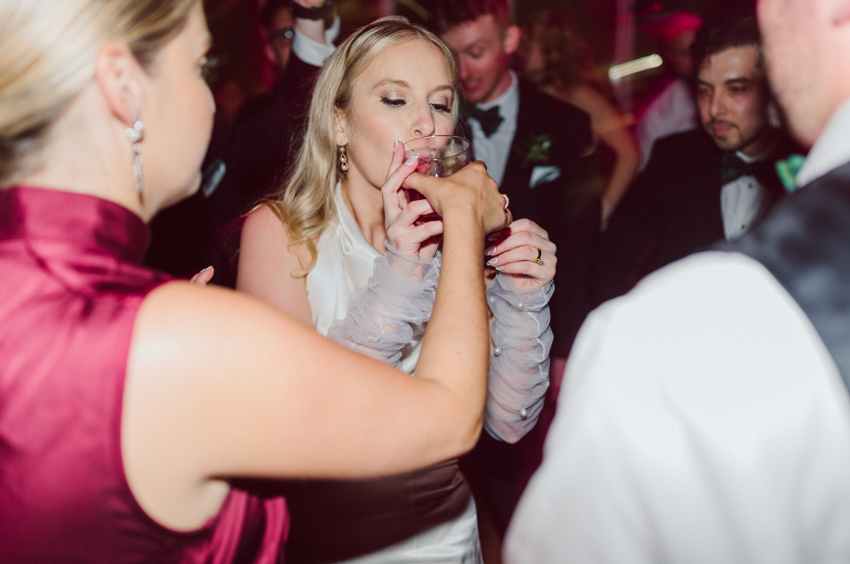 I've photographed multiple of Chris' best friends weddings several years ago. One couple at Tribeca Rooftop NY, another couple at Oheka Castle NY and few other friends at Long Island. So Chris knew when he was going to get married he would hire me. Few years later I get an email from Chris regarding his wedding. These are my dream ideal clients, because they know they will be hiring me even before they meet with me! After a quick phone call, Kaci and Chris booked and their engagement session date was set. We went to Orchard St in NYC where they used to live, walked around their old neighborhood while getting some engagement pics. Kaci and Chris' wedding at The Standard High Line, NY on April 22, 2023. It was raining for the whole week prior to Kaci and Chris wedding day making me bit worried but rain stopped on the morning of Kaci and Chris' wedding at The Standard High Line, NY. Kaci and Chris each got their own hotel rooms to get ready. With quite a big bridal party 10 bridesmaids and 10 groomsmen Kaci and Chris popped champagne bottles. With champagne glasses in their hands Kaci and her brides people laughed as they got their MUAH done by Face Time Beauty at The Standard High Line, NY. And Chris along with his groomsmen got ready in their very retro "Mad Men" vibe room fooling and goofing around till the ceremony at The Standard High Line, NY. Kaci and Chris wedding was held at The High Line Room and Terrace which overlooks The High Line, NY. Weather was gorgeous and I was excited to take Kaci and Chris to The High Line for their wedding portraits but unfortunately during their wedding ceremony at The High Line Room it started pouring! They say it's good luck when it rains on your wedding day, right! Unfortunately, going to The High Line for photos was no go, so backup was at The Terrace where the cocktail hour was going on and which was not even that big of a space. But with help of everyone I managed to get 22 people group photo done on The Terrace while the cocktail hour was going on and all the family formal photos as well as all the bridal party pairs. with only few minutes till Kaci and Chris' wedding reception at The High Line Room, we went up to The Top of Standard for Kaci and Chris' wedding portraits. Working super fast I managed to get good enough amount of wedding portraits of just Kaci and Chris. Music by Jack from LJDJ was playing, Kaci and Chris' wedding reception at The High Line Room at The Standard Hotel High Line NY was about to begin. Kaci and Chris' wedding reception at The Standard High Line was on fire from start to the last second of the evening. It was pouring outside, young people didn't seem to care it was raining and congregated the streets of Meatpacking District while I was weaving through the crowd of party goers to get home as quickly as possible. The night was just starting for them and I was ready for bed. Kaci and Chris' The High Line Room and Terrace, The Standard High Line, NY wedding documented by by Karis | Hey Karis | Catskills, Hudson Valley NY, elopement and wedding photographer | Brooklyn NY elopement and wedding photographer | Manhattan NY elopement and wedding photographer | Hey Karis is fun documentary wedding and elopement photographer.
