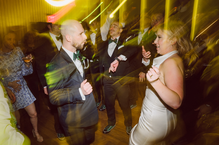 I've photographed multiple of Chris' best friends weddings several years ago. One couple at Tribeca Rooftop NY, another couple at Oheka Castle NY and few other friends at Long Island. So Chris knew when he was going to get married he would hire me. Few years later I get an email from Chris regarding his wedding. These are my dream ideal clients, because they know they will be hiring me even before they meet with me! After a quick phone call, Kaci and Chris booked and their engagement session date was set. We went to Orchard St in NYC where they used to live, walked around their old neighborhood while getting some engagement pics. Kaci and Chris' wedding at The Standard High Line, NY on April 22, 2023. It was raining for the whole week prior to Kaci and Chris wedding day making me bit worried but rain stopped on the morning of Kaci and Chris' wedding at The Standard High Line, NY. Kaci and Chris each got their own hotel rooms to get ready. With quite a big bridal party 10 bridesmaids and 10 groomsmen Kaci and Chris popped champagne bottles. With champagne glasses in their hands Kaci and her brides people laughed as they got their MUAH done by Face Time Beauty at The Standard High Line, NY. And Chris along with his groomsmen got ready in their very retro "Mad Men" vibe room fooling and goofing around till the ceremony at The Standard High Line, NY. Kaci and Chris wedding was held at The High Line Room and Terrace which overlooks The High Line, NY. Weather was gorgeous and I was excited to take Kaci and Chris to The High Line for their wedding portraits but unfortunately during their wedding ceremony at The High Line Room it started pouring! They say it's good luck when it rains on your wedding day, right! Unfortunately, going to The High Line for photos was no go, so backup was at The Terrace where the cocktail hour was going on and which was not even that big of a space. But with help of everyone I managed to get 22 people group photo done on The Terrace while the cocktail hour was going on and all the family formal photos as well as all the bridal party pairs. with only few minutes till Kaci and Chris' wedding reception at The High Line Room, we went up to The Top of Standard for Kaci and Chris' wedding portraits. Working super fast I managed to get good enough amount of wedding portraits of just Kaci and Chris. Music by Jack from LJDJ was playing, Kaci and Chris' wedding reception at The High Line Room at The Standard Hotel High Line NY was about to begin. Kaci and Chris' wedding reception at The Standard High Line was on fire from start to the last second of the evening. It was pouring outside, young people didn't seem to care it was raining and congregated the streets of Meatpacking District while I was weaving through the crowd of party goers to get home as quickly as possible. The night was just starting for them and I was ready for bed. Kaci and Chris' The High Line Room and Terrace, The Standard High Line, NY wedding documented by by Karis | Hey Karis | Catskills, Hudson Valley NY, elopement and wedding photographer | Brooklyn NY elopement and wedding photographer | Manhattan NY elopement and wedding photographer | Hey Karis is fun documentary wedding and elopement photographer.
