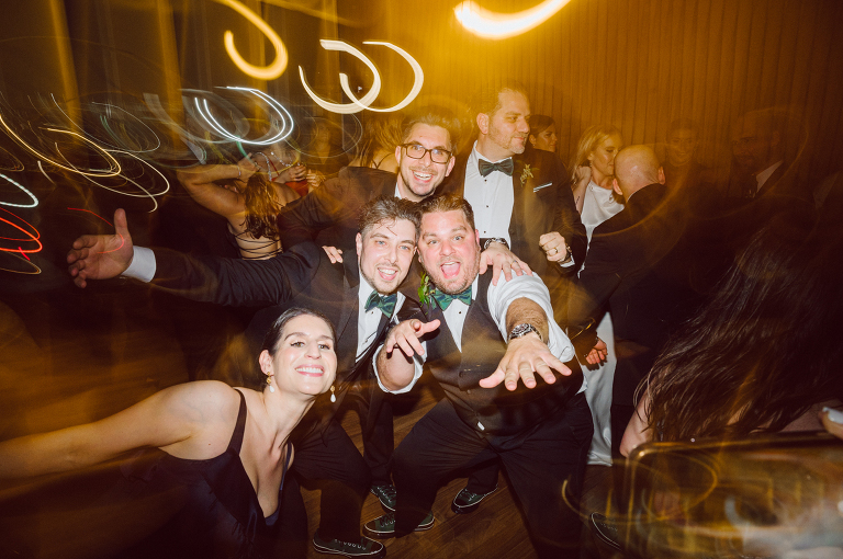 I've photographed multiple of Chris' best friends weddings several years ago. One couple at Tribeca Rooftop NY, another couple at Oheka Castle NY and few other friends at Long Island. So Chris knew when he was going to get married he would hire me. Few years later I get an email from Chris regarding his wedding. These are my dream ideal clients, because they know they will be hiring me even before they meet with me! After a quick phone call, Kaci and Chris booked and their engagement session date was set. We went to Orchard St in NYC where they used to live, walked around their old neighborhood while getting some engagement pics. Kaci and Chris' wedding at The Standard High Line, NY on April 22, 2023. It was raining for the whole week prior to Kaci and Chris wedding day making me bit worried but rain stopped on the morning of Kaci and Chris' wedding at The Standard High Line, NY. Kaci and Chris each got their own hotel rooms to get ready. With quite a big bridal party 10 bridesmaids and 10 groomsmen Kaci and Chris popped champagne bottles. With champagne glasses in their hands Kaci and her brides people laughed as they got their MUAH done by Face Time Beauty at The Standard High Line, NY. And Chris along with his groomsmen got ready in their very retro "Mad Men" vibe room fooling and goofing around till the ceremony at The Standard High Line, NY. Kaci and Chris wedding was held at The High Line Room and Terrace which overlooks The High Line, NY. Weather was gorgeous and I was excited to take Kaci and Chris to The High Line for their wedding portraits but unfortunately during their wedding ceremony at The High Line Room it started pouring! They say it's good luck when it rains on your wedding day, right! Unfortunately, going to The High Line for photos was no go, so backup was at The Terrace where the cocktail hour was going on and which was not even that big of a space. But with help of everyone I managed to get 22 people group photo done on The Terrace while the cocktail hour was going on and all the family formal photos as well as all the bridal party pairs. with only few minutes till Kaci and Chris' wedding reception at The High Line Room, we went up to The Top of Standard for Kaci and Chris' wedding portraits. Working super fast I managed to get good enough amount of wedding portraits of just Kaci and Chris. Music by Jack from LJDJ was playing, Kaci and Chris' wedding reception at The High Line Room at The Standard Hotel High Line NY was about to begin. Kaci and Chris' wedding reception at The Standard High Line was on fire from start to the last second of the evening. It was pouring outside, young people didn't seem to care it was raining and congregated the streets of Meatpacking District while I was weaving through the crowd of party goers to get home as quickly as possible. The night was just starting for them and I was ready for bed. Kaci and Chris' The High Line Room and Terrace, The Standard High Line, NY wedding documented by by Karis | Hey Karis | Catskills, Hudson Valley NY, elopement and wedding photographer | Brooklyn NY elopement and wedding photographer | Manhattan NY elopement and wedding photographer | Hey Karis is fun documentary wedding and elopement photographer.
