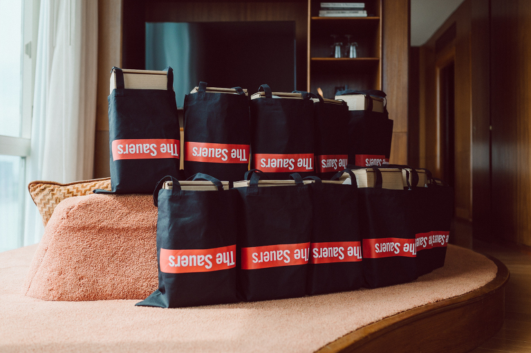 I've photographed multiple of Chris' best friends weddings several years ago. One couple at Tribeca Rooftop NY, another couple at Oheka Castle NY and few other friends at Long Island. So Chris knew when he was going to get married he would hire me. Few years later I get an email from Chris regarding his wedding. These are my dream ideal clients, because they know they will be hiring me even before they meet with me! After a quick phone call, Kaci and Chris booked and their engagement session date was set. We went to Orchard St in NYC where they used to live, walked around their old neighborhood while getting some engagement pics. Kaci and Chris' wedding at The Standard High Line, NY on April 22, 2023. It was raining for the whole week prior to Kaci and Chris wedding day making me bit worried but rain stopped on the morning of Kaci and Chris' wedding at The Standard High Line, NY. Kaci and Chris each got their own hotel rooms to get ready. With quite a big bridal party 10 bridesmaids and 10 groomsmen Kaci and Chris popped champagne bottles. With champagne glasses in their hands Kaci and her brides people laughed as they got their MUAH done by Face Time Beauty at The Standard High Line, NY. And Chris along with his groomsmen got ready in their very retro "Mad Men" vibe room fooling and goofing around till the ceremony at The Standard High Line, NY. Kaci and Chris wedding was held at The High Line Room and Terrace which overlooks The High Line, NY. Weather was gorgeous and I was excited to take Kaci and Chris to The High Line for their wedding portraits but unfortunately during their wedding ceremony at The High Line Room it started pouring! They say it's good luck when it rains on your wedding day, right! Unfortunately, going to The High Line for photos was no go, so backup was at The Terrace where the cocktail hour was going on and which was not even that big of a space. But with help of everyone I managed to get 22 people group photo done on The Terrace while the cocktail hour was going on and all the family formal photos as well as all the bridal party pairs. with only few minutes till Kaci and Chris' wedding reception at The High Line Room, we went up to The Top of Standard for Kaci and Chris' wedding portraits. Working super fast I managed to get good enough amount of wedding portraits of just Kaci and Chris. Music by Jack from LJDJ was playing, Kaci and Chris' wedding reception at The High Line Room at The Standard Hotel High Line NY was about to begin. Kaci and Chris' wedding reception at The Standard High Line was on fire from start to the last second of the evening. It was pouring outside, young people didn't seem to care it was raining and congregated the streets of Meatpacking District while I was weaving through the crowd of party goers to get home as quickly as possible. The night was just starting for them and I was ready for bed. Kaci and Chris' The High Line Room and Terrace, The Standard High Line, NY wedding documented by by Karis | Hey Karis | Catskills, Hudson Valley NY, elopement and wedding photographer | Brooklyn NY elopement and wedding photographer | Manhattan NY elopement and wedding photographer | Hey Karis is fun documentary wedding and elopement photographer.