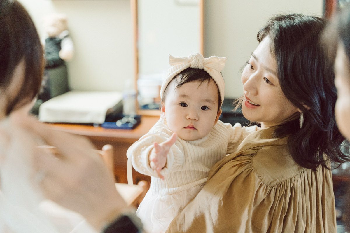 Chloe and Bosco are one of the sweetest couple!!! Well mannered, kind, sweet, considerate so I was extra excited for Chloe and Bosco's wedding at The Chart House. Chloe and Bosco both got ready at Chole's parents house in Oradell NJ where both sets of parents were all gathered. With no bridal party Chloe and Bosco had a quiet wedding morning. Midway through the morning prep, it started raining outside and did not look like we will be going outside for photos anytime soon or even till evening at Weehawken. With wishful mind of clear sky later, we got photos with family, parents and the couple at Chole's parent's house before leaving for Chloe and Bosco's wedding ceremony at St. Michaels Church in Fort Lee, NJ. St. Michales Church is small cute Korean Catholic church in Fort Lee, NJ where Chloe and Bosco belongs to. We can hear the rain falling down harder while getting group and family formal photos at St. Michaels Church before heading to Chart House in Weehawken NJ for Chloe and Bosco's intimate wedding reception. By the time we were in the car to drive over to Chart House, it was POURING. Chart House was busy with weekend customers enjoying the restaurant and they had three events going on upstairs! The entrance to Chart House was crowded with people coming and leaving waiting for the valet to bring their cars. Chloe and Bosco with help of their friends DIYed lots of wedding decor, music and games/entertainment during their wedding reception at Chart House. My heart really belongs to these small and intimate weddings where the couple focuses on them and what is really important to them instead of a big wedding celebration to show off of copy what they saw on social media. Sweet and lovely intimate wedding of Chloe and Bosco at Chart House Weehawken NJ wedding documented by by Karis | Hey Karis | Catskills, Hudson Valley NY elopement and wedding photographer | Brooklyn NY elopement and wedding photographer | Manhattan NY elopement and wedding photographer | Hey Karis is fun documentary wedding and elopement photographer.
