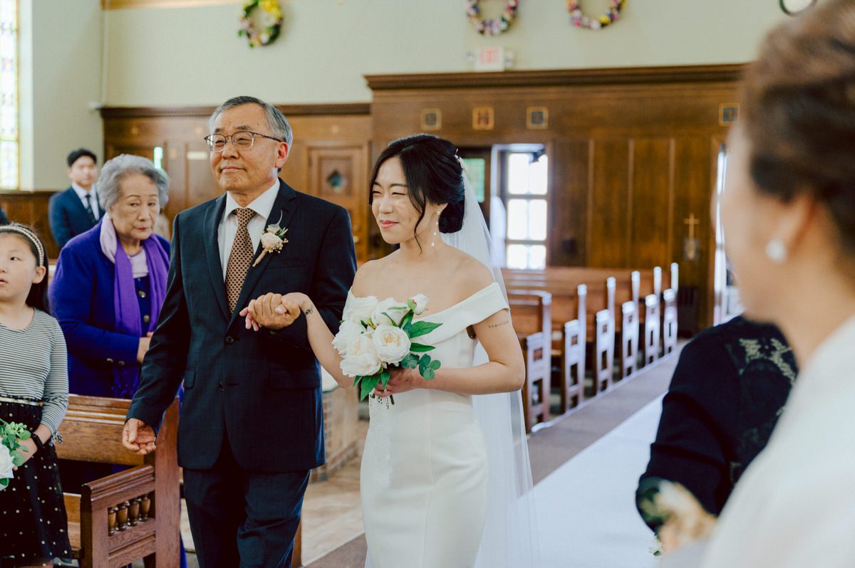 Chloe and Bosco are one of the sweetest couple!!! Well mannered, kind, sweet, considerate so I was extra excited for Chloe and Bosco's wedding at The Chart House. Chloe and Bosco both got ready at Chole's parents house in Oradell NJ where both sets of parents were all gathered. With no bridal party Chloe and Bosco had a quiet wedding morning. Midway through the morning prep, it started raining outside and did not look like we will be going outside for photos anytime soon or even till evening at Weehawken. With wishful mind of clear sky later, we got photos with family, parents and the couple at Chole's parent's house before leaving for Chloe and Bosco's wedding ceremony at St. Michaels Church in Fort Lee, NJ. St. Michales Church is small cute Korean Catholic church in Fort Lee, NJ where Chloe and Bosco belongs to. We can hear the rain falling down harder while getting group and family formal photos at St. Michaels Church before heading to Chart House in Weehawken NJ for Chloe and Bosco's intimate wedding reception. By the time we were in the car to drive over to Chart House, it was POURING. Chart House was busy with weekend customers enjoying the restaurant and they had three events going on upstairs! The entrance to Chart House was crowded with people coming and leaving waiting for the valet to bring their cars. Chloe and Bosco with help of their friends DIYed lots of wedding decor, music and games/entertainment during their wedding reception at Chart House. My heart really belongs to these small and intimate weddings where the couple focuses on them and what is really important to them instead of a big wedding celebration to show off of copy what they saw on social media. Sweet and lovely intimate wedding of Chloe and Bosco at Chart House Weehawken NJ wedding documented by by Karis | Hey Karis | Catskills, Hudson Valley NY elopement and wedding photographer | Brooklyn NY elopement and wedding photographer | Manhattan NY elopement and wedding photographer | Hey Karis is fun documentary wedding and elopement photographer.
