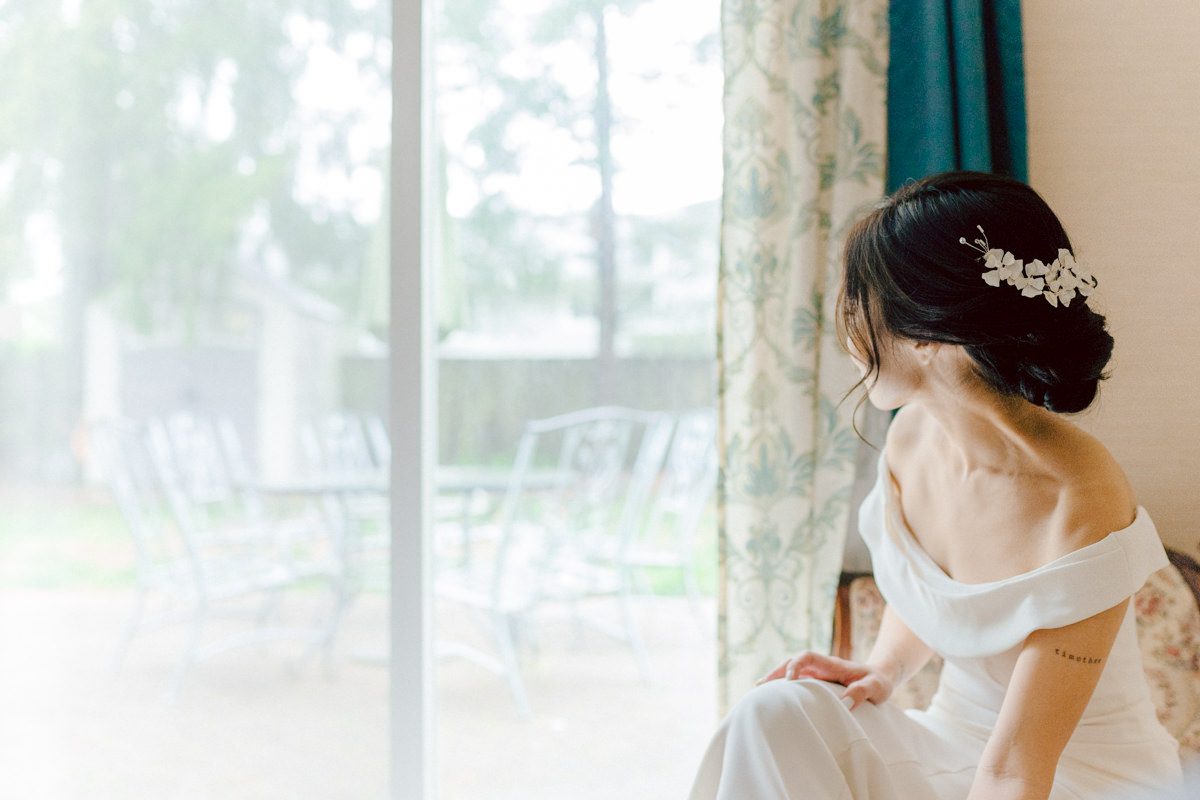 Chloe and Bosco are one of the sweetest couple!!! Well mannered, kind, sweet, considerate so I was extra excited for Chloe and Bosco's wedding at The Chart House. Chloe and Bosco both got ready at Chole's parents house in Oradell NJ where both sets of parents were all gathered. With no bridal party Chloe and Bosco had a quiet wedding morning. Midway through the morning prep, it started raining outside and did not look like we will be going outside for photos anytime soon or even till evening at Weehawken. With wishful mind of clear sky later, we got photos with family, parents and the couple at Chole's parent's house before leaving for Chloe and Bosco's wedding ceremony at St. Michaels Church in Fort Lee, NJ. St. Michales Church is small cute Korean Catholic church in Fort Lee, NJ where Chloe and Bosco belongs to. We can hear the rain falling down harder while getting group and family formal photos at St. Michaels Church before heading to Chart House in Weehawken NJ for Chloe and Bosco's intimate wedding reception. By the time we were in the car to drive over to Chart House, it was POURING. Chart House was busy with weekend customers enjoying the restaurant and they had three events going on upstairs! The entrance to Chart House was crowded with people coming and leaving waiting for the valet to bring their cars. Chloe and Bosco with help of their friends DIYed lots of wedding decor, music and games/entertainment during their wedding reception at Chart House. My heart really belongs to these small and intimate weddings where the couple focuses on them and what is really important to them instead of a big wedding celebration to show off of copy what they saw on social media. Sweet and lovely intimate wedding of Chloe and Bosco at Chart House Weehawken NJ wedding documented by by Karis | Hey Karis | Catskills, Hudson Valley NY elopement and wedding photographer | Brooklyn NY elopement and wedding photographer | Manhattan NY elopement and wedding photographer | Hey Karis is fun documentary wedding and elopement photographer.
