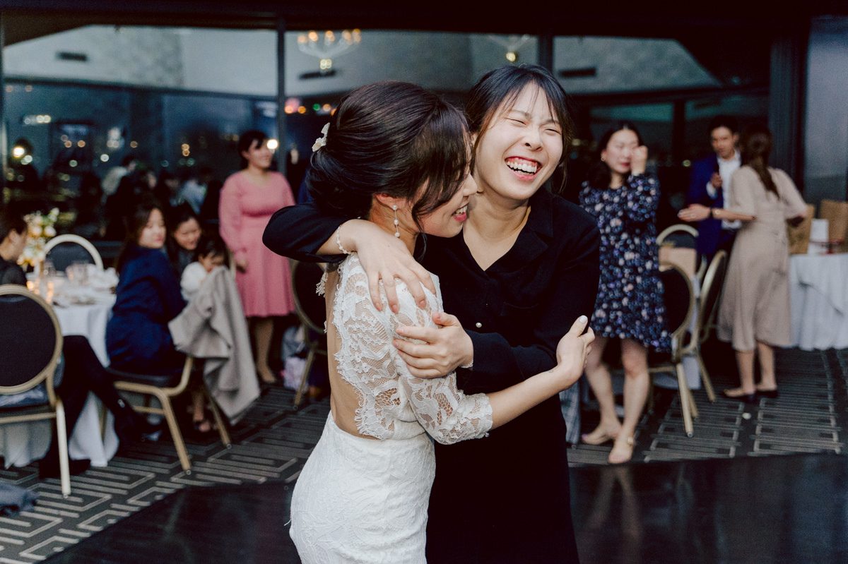 Chloe and Bosco are one of the sweetest couple!!! Well mannered, kind, sweet, considerate so I was extra excited for Chloe and Bosco's wedding at The Chart House. Chloe and Bosco both got ready at Chole's parents house in Oradell NJ where both sets of parents were all gathered. With no bridal party Chloe and Bosco had a quiet wedding morning. Midway through the morning prep, it started raining outside and did not look like we will be going outside for photos anytime soon or even till evening at Weehawken. With wishful mind of clear sky later, we got photos with family, parents and the couple at Chole's parent's house before leaving for Chloe and Bosco's wedding ceremony at St. Michaels Church in Fort Lee, NJ. St. Michales Church is small cute Korean Catholic church in Fort Lee, NJ where Chloe and Bosco belongs to. We can hear the rain falling down harder while getting group and family formal photos at St. Michaels Church before heading to Chart House in Weehawken NJ for Chloe and Bosco's intimate wedding reception. By the time we were in the car to drive over to Chart House, it was POURING. Chart House was busy with weekend customers enjoying the restaurant and they had three events going on upstairs! The entrance to Chart House was crowded with people coming and leaving waiting for the valet to bring their cars. Chloe and Bosco with help of their friends DIYed lots of wedding decor, music and games/entertainment during their wedding reception at Chart House. My heart really belongs to these small and intimate weddings where the couple focuses on them and what is really important to them instead of a big wedding celebration to show off of copy what they saw on social media. Sweet and lovely intimate wedding of Chloe and Bosco at Chart House Weehawken NJ wedding documented by by Karis | Hey Karis | Catskills, Hudson Valley NY elopement and wedding photographer | Brooklyn NY elopement and wedding photographer | Manhattan NY elopement and wedding photographer | Hey Karis is fun documentary wedding and elopement photographer.
