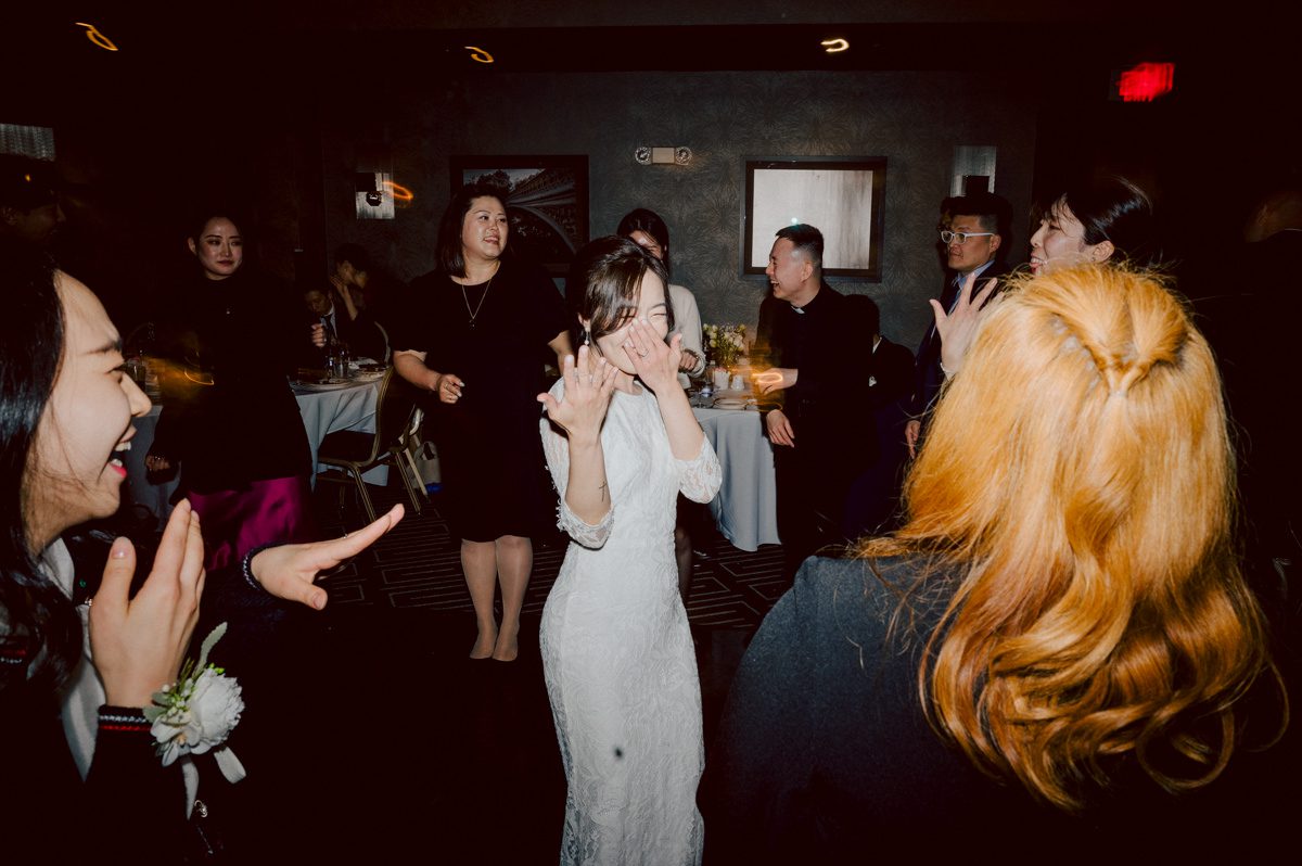 Chloe and Bosco are one of the sweetest couple!!! Well mannered, kind, sweet, considerate so I was extra excited for Chloe and Bosco's wedding at The Chart House. Chloe and Bosco both got ready at Chole's parents house in Oradell NJ where both sets of parents were all gathered. With no bridal party Chloe and Bosco had a quiet wedding morning. Midway through the morning prep, it started raining outside and did not look like we will be going outside for photos anytime soon or even till evening at Weehawken. With wishful mind of clear sky later, we got photos with family, parents and the couple at Chole's parent's house before leaving for Chloe and Bosco's wedding ceremony at St. Michaels Church in Fort Lee, NJ. St. Michales Church is small cute Korean Catholic church in Fort Lee, NJ where Chloe and Bosco belongs to. We can hear the rain falling down harder while getting group and family formal photos at St. Michaels Church before heading to Chart House in Weehawken NJ for Chloe and Bosco's intimate wedding reception. By the time we were in the car to drive over to Chart House, it was POURING. Chart House was busy with weekend customers enjoying the restaurant and they had three events going on upstairs! The entrance to Chart House was crowded with people coming and leaving waiting for the valet to bring their cars. Chloe and Bosco with help of their friends DIYed lots of wedding decor, music and games/entertainment during their wedding reception at Chart House. My heart really belongs to these small and intimate weddings where the couple focuses on them and what is really important to them instead of a big wedding celebration to show off of copy what they saw on social media. Sweet and lovely intimate wedding of Chloe and Bosco at Chart House Weehawken NJ wedding documented by by Karis | Hey Karis | Catskills, Hudson Valley NY elopement and wedding photographer | Brooklyn NY elopement and wedding photographer | Manhattan NY elopement and wedding photographer | Hey Karis is fun documentary wedding and elopement photographer.
