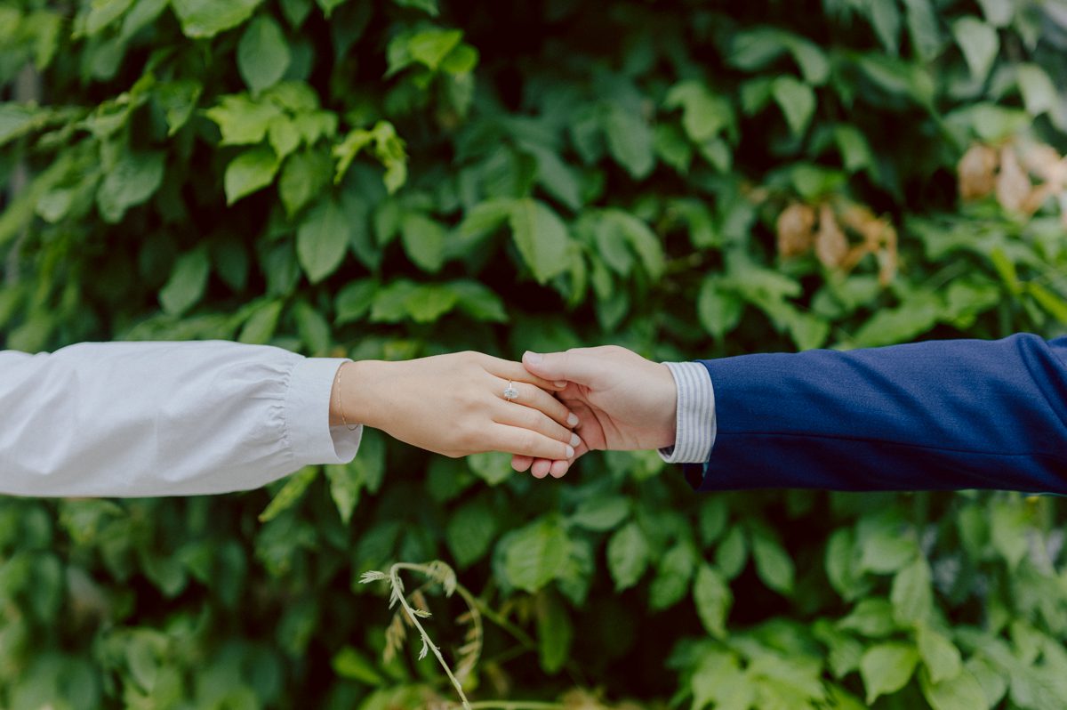 Washington Square Park along with University St as well as Washington Mews were all very quiet and empty Saturday morning. Unusually empty and that is when I realized NYU along with all colleges/universities were out for the summer which means all the students left NYC for the summer. Also meant we had the luxury of having the whole Washington Mews to ourselves during Renee and Sam's engagement session. We walked up and down the cobble stone street of Washington Mews choosing which backdrop, which colorful brick wall and which rustic door we liked best. Roses and green vines covered the walls of Washington Mews making us feel like as if we were in streets of Europe. Washington Mews is truly a gem in this concrete jungle called Manhattan. Renee and Sam's Washington Mews NY Engagement Session documented by by Karis | Hey Karis | Catskills, Hudson Valley NY elopement and wedding photographer | Brooklyn NY elopement and wedding photographer | Manhattan NY elopement and wedding photographer | Hey Karis is fun documentary wedding and elopement photographer.
