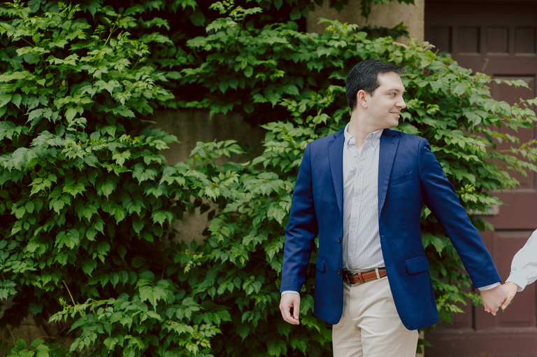Washington Square Park along with University St as well as Washington Mews were all very quiet and empty Saturday morning. Unusually empty and that is when I realized NYU along with all colleges/universities were out for the summer which means all the students left NYC for the summer. Also meant we had the luxury of having the whole Washington Mews to ourselves during Renee and Sam's engagement session. We walked up and down the cobble stone street of Washington Mews choosing which backdrop, which colorful brick wall and which rustic door we liked best. Roses and green vines covered the walls of Washington Mews making us feel like as if we were in streets of Europe. Washington Mews is truly a gem in this concrete jungle called Manhattan. Renee and Sam's Washington Mews NY Engagement Session documented by by Karis | Hey Karis | Catskills, Hudson Valley NY elopement and wedding photographer | Brooklyn NY elopement and wedding photographer | Manhattan NY elopement and wedding photographer | Hey Karis is fun documentary wedding and elopement photographer.
