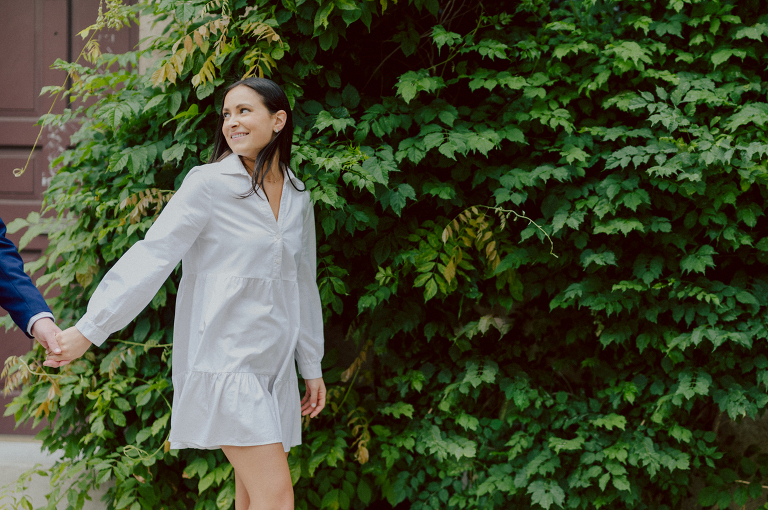 Washington Square Park along with University St as well as Washington Mews were all very quiet and empty Saturday morning. Unusually empty and that is when I realized NYU along with all colleges/universities were out for the summer which means all the students left NYC for the summer. Also meant we had the luxury of having the whole Washington Mews to ourselves during Renee and Sam's engagement session. We walked up and down the cobble stone street of Washington Mews choosing which backdrop, which colorful brick wall and which rustic door we liked best. Roses and green vines covered the walls of Washington Mews making us feel like as if we were in streets of Europe. Washington Mews is truly a gem in this concrete jungle called Manhattan. Renee and Sam's Washington Mews NY Engagement Session documented by by Karis | Hey Karis | Catskills, Hudson Valley NY elopement and wedding photographer | Brooklyn NY elopement and wedding photographer | Manhattan NY elopement and wedding photographer | Hey Karis is fun documentary wedding and elopement photographer.
