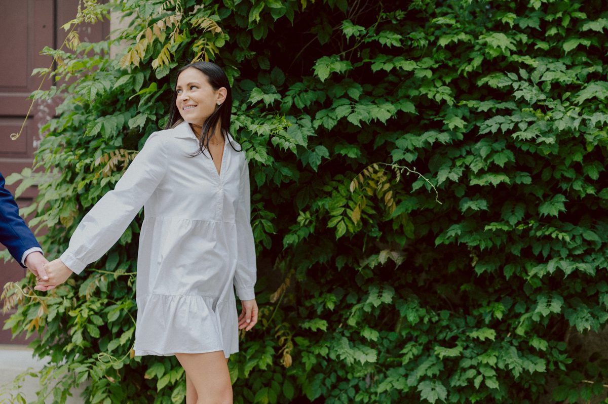 Washington Square Park along with University St as well as Washington Mews were all very quiet and empty Saturday morning. Unusually empty and that is when I realized NYU along with all colleges/universities were out for the summer which means all the students left NYC for the summer. Also meant we had the luxury of having the whole Washington Mews to ourselves during Renee and Sam's engagement session. We walked up and down the cobble stone street of Washington Mews choosing which backdrop, which colorful brick wall and which rustic door we liked best. Roses and green vines covered the walls of Washington Mews making us feel like as if we were in streets of Europe. Washington Mews is truly a gem in this concrete jungle called Manhattan. Renee and Sam's Washington Mews NY Engagement Session documented by by Karis | Hey Karis | Catskills, Hudson Valley NY elopement and wedding photographer | Brooklyn NY elopement and wedding photographer | Manhattan NY elopement and wedding photographer | Hey Karis is fun documentary wedding and elopement photographer.
