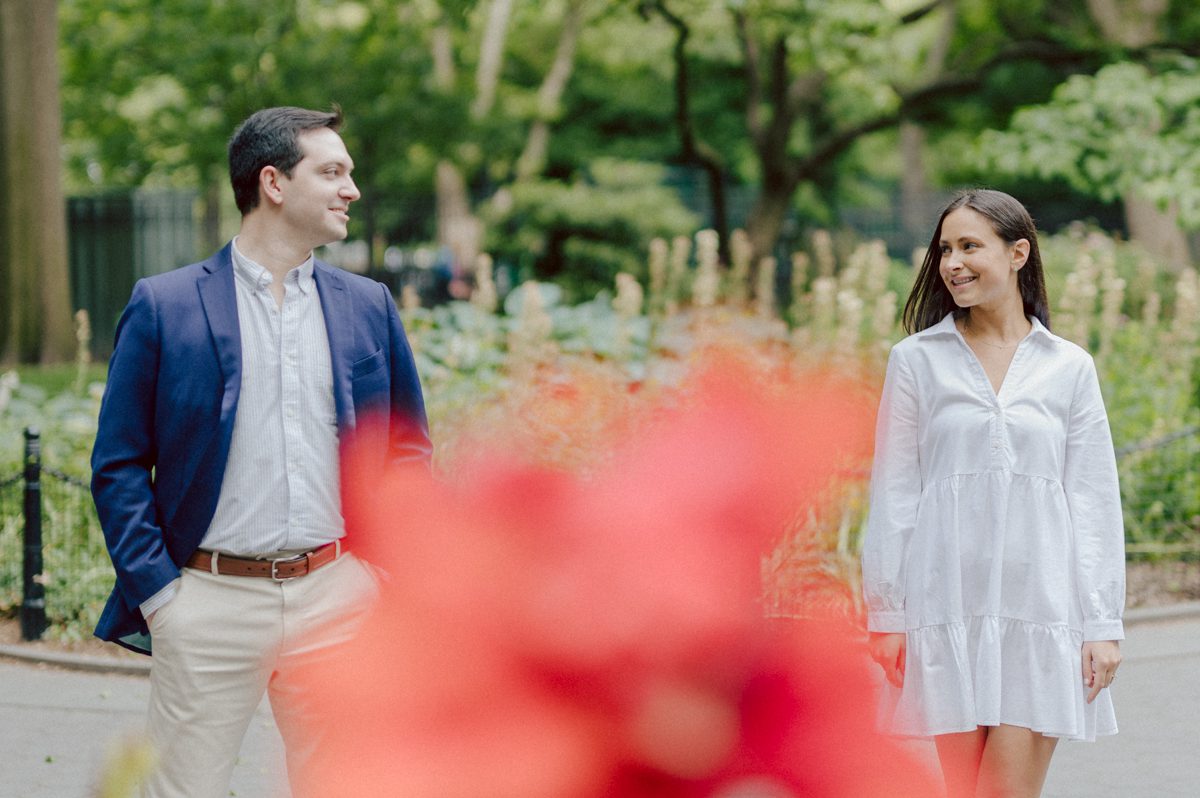 Washington Square Park along with University St as well as Washington Mews were all very quiet and empty Saturday morning. Unusually empty and that is when I realized NYU along with all colleges/universities were out for the summer which means all the students left NYC for the summer. Also meant we had the luxury of having the whole Washington Mews to ourselves during Renee and Sam's engagement session. We walked up and down the cobble stone street of Washington Mews choosing which backdrop, which colorful brick wall and which rustic door we liked best. Roses and green vines covered the walls of Washington Mews making us feel like as if we were in streets of Europe. Washington Mews is truly a gem in this concrete jungle called Manhattan. Renee and Sam's Washington Mews NY Engagement Session documented by by Karis | Hey Karis | Catskills, Hudson Valley NY elopement and wedding photographer | Brooklyn NY elopement and wedding photographer | Manhattan NY elopement and wedding photographer | Hey Karis is fun documentary wedding and elopement photographer.
