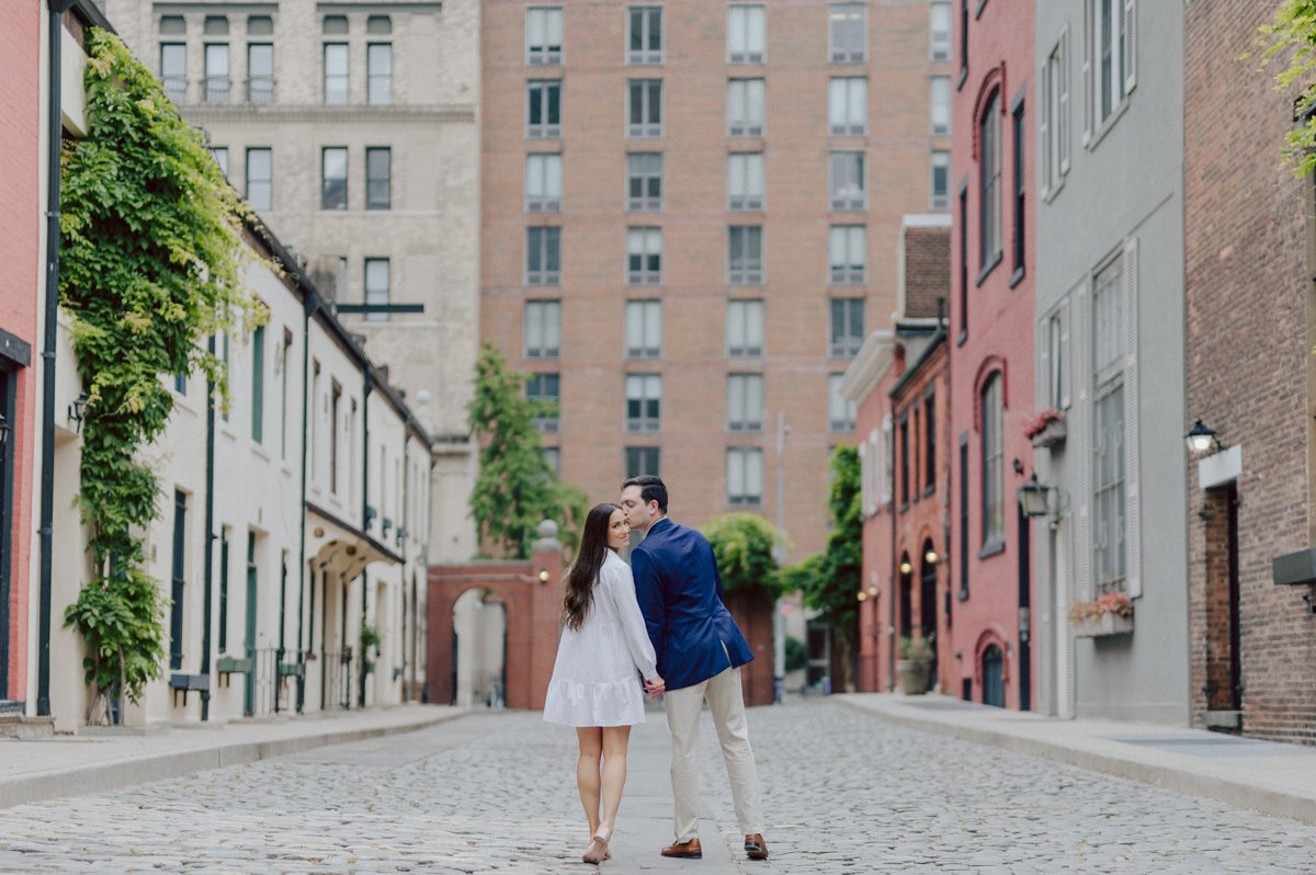 Washington Square Park along with University St as well as Washington Mews were all very quiet and empty Saturday morning. Unusually empty and that is when I realized NYU along with all colleges/universities were out for the summer which means all the students left NYC for the summer. Also meant we had the luxury of having the whole Washington Mews to ourselves during Renee and Sam's engagement session. We walked up and down the cobble stone street of Washington Mews choosing which backdrop, which colorful brick wall and which rustic door we liked best. Roses and green vines covered the walls of Washington Mews making us feel like as if we were in streets of Europe. Washington Mews is truly a gem in this concrete jungle called Manhattan. Renee and Sam's Washington Mews NY Engagement Session documented by by Karis | Hey Karis | Catskills, Hudson Valley NY elopement and wedding photographer | Brooklyn NY elopement and wedding photographer | Manhattan NY elopement and wedding photographer | Hey Karis is fun documentary wedding and elopement photographer.
