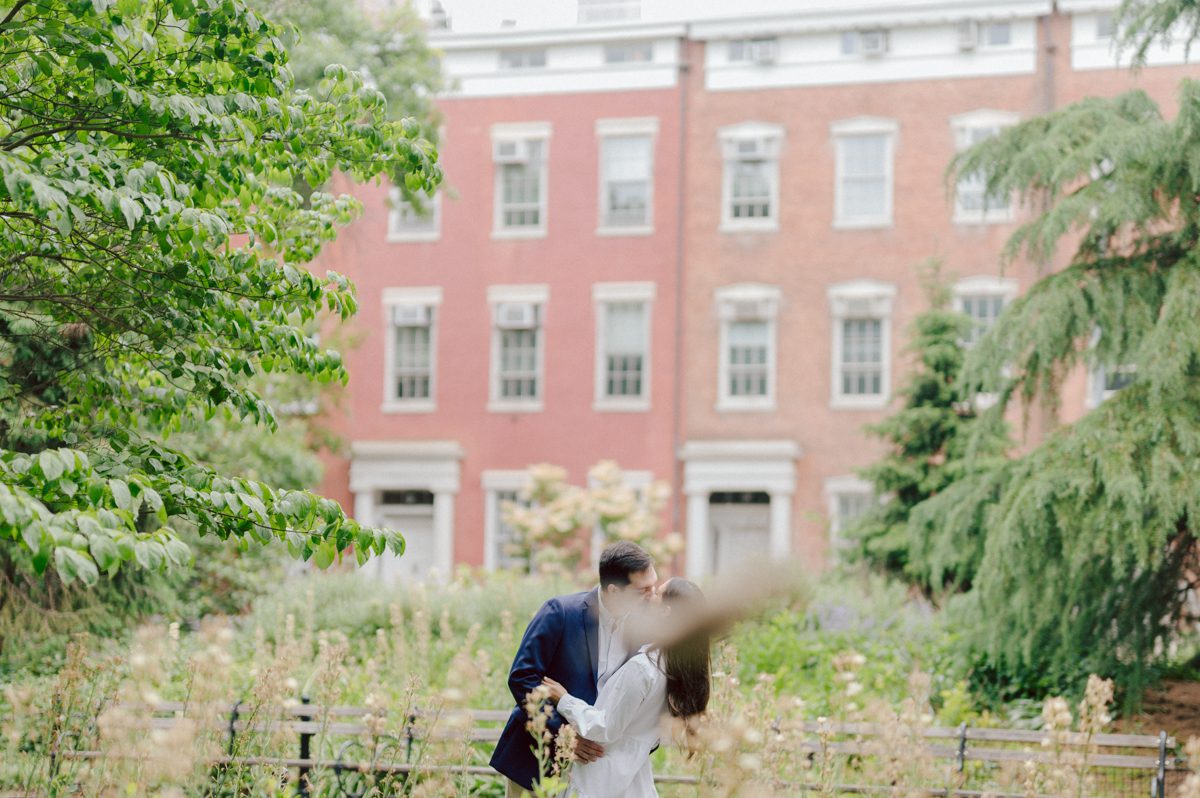 Washington Square Park along with University St as well as Washington Mews were all very quiet and empty Saturday morning. Unusually empty and that is when I realized NYU along with all colleges/universities were out for the summer which means all the students left NYC for the summer. Also meant we had the luxury of having the whole Washington Mews to ourselves during Renee and Sam's engagement session. We walked up and down the cobble stone street of Washington Mews choosing which backdrop, which colorful brick wall and which rustic door we liked best. Roses and green vines covered the walls of Washington Mews making us feel like as if we were in streets of Europe. Washington Mews is truly a gem in this concrete jungle called Manhattan. Renee and Sam's Washington Mews NY Engagement Session documented by by Karis | Hey Karis | Catskills, Hudson Valley NY elopement and wedding photographer | Brooklyn NY elopement and wedding photographer | Manhattan NY elopement and wedding photographer | Hey Karis is fun documentary wedding and elopement photographer.
