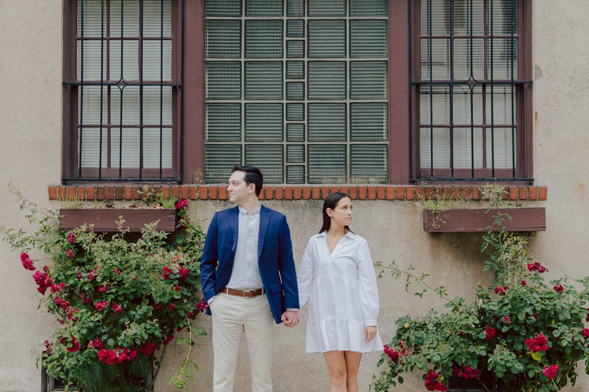Washington Square Park along with University St as well as Washington Mews were all very quiet and empty Saturday morning. Unusually empty and that is when I realized NYU along with all colleges/universities were out for the summer which means all the students left NYC for the summer. Also meant we had the luxury of having the whole Washington Mews to ourselves during Renee and Sam's engagement session. We walked up and down the cobble stone street of Washington Mews choosing which backdrop, which colorful brick wall and which rustic door we liked best. Roses and green vines covered the walls of Washington Mews making us feel like as if we were in streets of Europe. Washington Mews is truly a gem in this concrete jungle called Manhattan. Renee and Sam's Washington Mews NY Engagement Session documented by by Karis | Hey Karis | Catskills, Hudson Valley NY elopement and wedding photographer | Brooklyn NY elopement and wedding photographer | Manhattan NY elopement and wedding photographer | Hey Karis is fun documentary wedding and elopement photographer.
