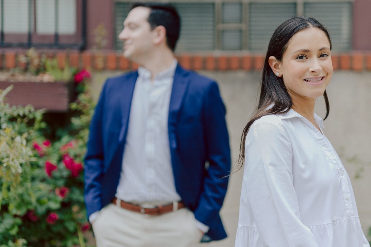 Washington Square Park along with University St as well as Washington Mews were all very quiet and empty Saturday morning. Unusually empty and that is when I realized NYU along with all colleges/universities were out for the summer which means all the students left NYC for the summer. Also meant we had the luxury of having the whole Washington Mews to ourselves during Renee and Sam's engagement session. We walked up and down the cobble stone street of Washington Mews choosing which backdrop, which colorful brick wall and which rustic door we liked best. Roses and green vines covered the walls of Washington Mews making us feel like as if we were in streets of Europe. Washington Mews is truly a gem in this concrete jungle called Manhattan. Renee and Sam's Washington Mews NY Engagement Session documented by by Karis | Hey Karis | Catskills, Hudson Valley NY elopement and wedding photographer | Brooklyn NY elopement and wedding photographer | Manhattan NY elopement and wedding photographer | Hey Karis is fun documentary wedding and elopement photographer.
