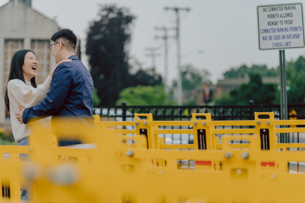 As I was about to walk into Ridgewood Coffee Company on Ridgewood Ave I saw Jane and Kevin walking out of their car. Kevin's face brightened up into big smile and came over to give me a hug then Jane turning and saw me. Jane and Kevin are one of those people that really appreciates me, big huge fans of my work and I am so honored to have earned their trust and love. Jane and Kevin are my people and they are my tribe. I love love shooting at small downtown because of it's variety of backdrops, every corner is different, new, exciting. It was such a joy wandering around downtown Ridgewood with two people that would do anything that I tell them to. Jane and Kevin were such a delightful people, they make me laugh and smile if I think of them. I can't wait to celebrate with them again on their wedding at Tides Estate till then these adorable and fun engagement photo will have to do. Jane and Kevin's Downtown Ridgewood NJ egagement Session documented by by Karis | Hey Karis | Catskills, Hudson Valley NY elopement and wedding photographer | Brooklyn NY elopement and wedding photographer | Manhattan NY elopement and wedding photographer | Hey Karis is fun documentary wedding and elopement photographer.