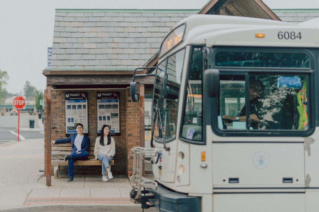 As I was about to walk into Ridgewood Coffee Company on Ridgewood Ave I saw Jane and Kevin walking out of their car. Kevin's face brightened up into big smile and came over to give me a hug then Jane turning and saw me. Jane and Kevin are one of those people that really appreciates me, big huge fans of my work and I am so honored to have earned their trust and love. Jane and Kevin are my people and they are my tribe. I love love shooting at small downtown because of it's variety of backdrops, every corner is different, new, exciting. It was such a joy wandering around downtown Ridgewood with two people that would do anything that I tell them to. Jane and Kevin were such a delightful people, they make me laugh and smile if I think of them. I can't wait to celebrate with them again on their wedding at Tides Estate till then these adorable and fun engagement photo will have to do. Jane and Kevin's Downtown Ridgewood NJ egagement Session documented by by Karis | Hey Karis | Catskills, Hudson Valley NY elopement and wedding photographer | Brooklyn NY elopement and wedding photographer | Manhattan NY elopement and wedding photographer | Hey Karis is fun documentary wedding and elopement photographer.