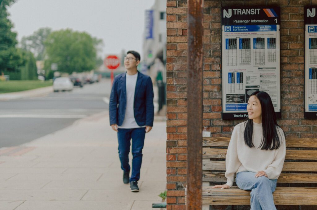 As I was about to walk into Ridgewood Coffee Company on Ridgewood Ave I saw Jane and Kevin walking out of their car. Kevin's face brightened up into big smile and came over to give me a hug then Jane turning and saw me. Jane and Kevin are one of those people that really appreciates me, big huge fans of my work and I am so honored to have earned their trust and love. Jane and Kevin are my people and they are my tribe. I love love shooting at small downtown because of it's variety of backdrops, every corner is different, new, exciting. It was such a joy wandering around downtown Ridgewood with two people that would do anything that I tell them to. Jane and Kevin were such a delightful people, they make me laugh and smile if I think of them. I can't wait to celebrate with them again on their wedding at Tides Estate till then these adorable and fun engagement photo will have to do. Jane and Kevin's Downtown Ridgewood NJ egagement Session documented by by Karis | Hey Karis | Catskills, Hudson Valley NY elopement and wedding photographer | Brooklyn NY elopement and wedding photographer | Manhattan NY elopement and wedding photographer | Hey Karis is fun documentary wedding and elopement photographer.