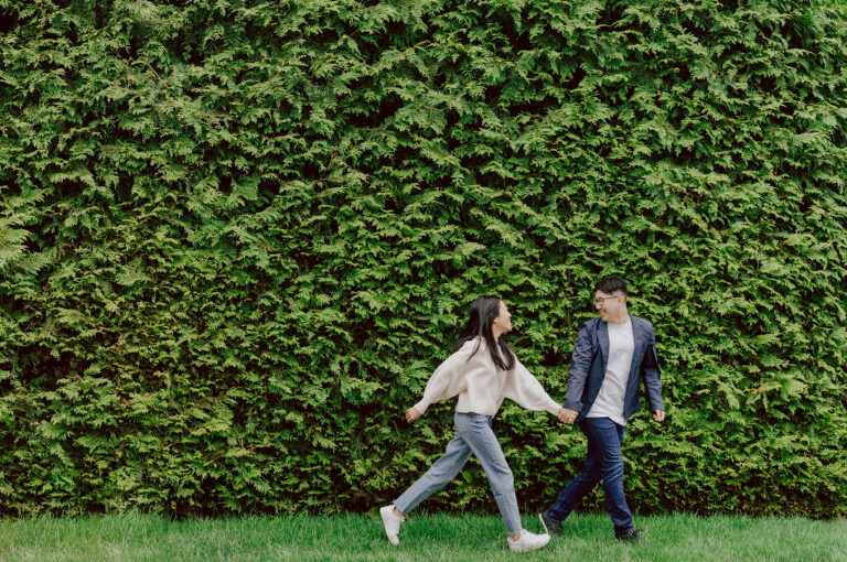 As I was about to walk into Ridgewood Coffee Company on Ridgewood Ave I saw Jane and Kevin walking out of their car. Kevin's face brightened up into big smile and came over to give me a hug then Jane turning and saw me. Jane and Kevin are one of those people that really appreciates me, big huge fans of my work and I am so honored to have earned their trust and love. Jane and Kevin are my people and they are my tribe. I love love shooting at small downtown because of it's variety of backdrops, every corner is different, new, exciting. It was such a joy wandering around downtown Ridgewood with two people that would do anything that I tell them to. Jane and Kevin were such a delightful people, they make me laugh and smile if I think of them. I can't wait to celebrate with them again on their wedding at Tides Estate till then these adorable and fun engagement photo will have to do. Jane and Kevin's Downtown Ridgewood NJ egagement Session documented by by Karis | Hey Karis | Catskills, Hudson Valley NY elopement and wedding photographer | Brooklyn NY elopement and wedding photographer | Manhattan NY elopement and wedding photographer | Hey Karis is fun documentary wedding and elopement photographer.