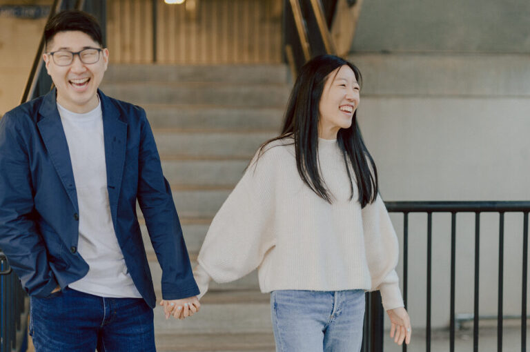 As I was about to walk into Ridgewood Coffee Company on Ridgewood Ave I saw Jane and Kevin walking out of their car. Kevin's face brightened up into big smile and came over to give me a hug then Jane turning and saw me. Jane and Kevin are one of those people that really appreciates me, big huge fans of my work and I am so honored to have earned their trust and love. Jane and Kevin are my people and they are my tribe. I love love shooting at small downtown because of it's variety of backdrops, every corner is different, new, exciting. It was such a joy wandering around downtown Ridgewood with two people that would do anything that I tell them to. Jane and Kevin were such a delightful people, they make me laugh and smile if I think of them. I can't wait to celebrate with them again on their wedding at Tides Estate till then these adorable and fun engagement photo will have to do. Jane and Kevin's Downtown Ridgewood NJ egagement Session documented by by Karis | Hey Karis | Catskills, Hudson Valley NY elopement and wedding photographer | Brooklyn NY elopement and wedding photographer | Manhattan NY elopement and wedding photographer | Hey Karis is fun documentary wedding and elopement photographer.