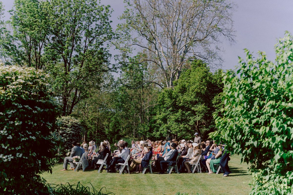 Woolverton Inn located in Stockton NJ is truly one of a kind magical place in NJ. Woolverton Inn is a bed and breakfast with 14 cottages and guest rooms which is perfect way to celebrate your wedding for the whole weekend with family and friends. Tara and Matt along with their family spent the whole weekend at Woolverton Inn celebrating their wedding. Tara and Matt's goal for their wedding was to have an intimate, chill and relaxed wedding weekend with their loved ones. No bridal party, no formalities, no rules but Tara and Matt only wanted to celebrate their wedding their way. No cheesy entrances, no sleazy DJ and no awkward parent dances, but instead they had a classic band "Dennis Pol Music" playing jazz music into the dark night. It was perfect weather, perfect evening to be having a tent wedding at Woolverton Inn. Tara and Matt woke up to get ready for their wedding at Woolverton Inn. Beauty and the Blush team was doing hair/makeup and soon Tara got into her pink Alexander McQueen wedding dress. I loved everything about Tara and Matt's wedding at Woolverton Inn from how chill and relaxed it was, Tara's pink Alexander McQueen wedding dress, and the fact that there was absolutely no bridal party! Focusing on the two people, bride and groom was only thing that mattered on Tara and Matt's wedding day. Tara and Matt's Woolverton Inn garden wedding ceremony was beautiful and sweet. Tara and Matt's cocktail hour at Woolverton Inn was like a gorgeous painting. Then when the cocktail hour ended guests walked along the path to the tent where the reception was held and on the way to the tent Tara and Matt stopped by the Sheep to get some photos with the adorable Woolverton Inn's most social most famous Miss Annie the sheep. Miss Annie is only sheep at Woolverton that is not afraid of people so when the snacks came out Miss Annie instantly ran over to tara and Matt. The rest of the evening, Tara and Matt walked around the tent talking to every single guests with amazing food and drinks Tara and Matt celebrated their wedding at Woolverton Inn exact way they wanted to and it was perfect! Tara and Matt's Woolverton Inn Stockton NJ wedding documented by by Karis | Hey Karis | Catskills, Hudson Valley NY elopement and wedding photographer | Brooklyn NY elopement and wedding photographer | Manhattan NY elopement and wedding photographer | Hey Karis is fun documentary wedding and elopement photographer.