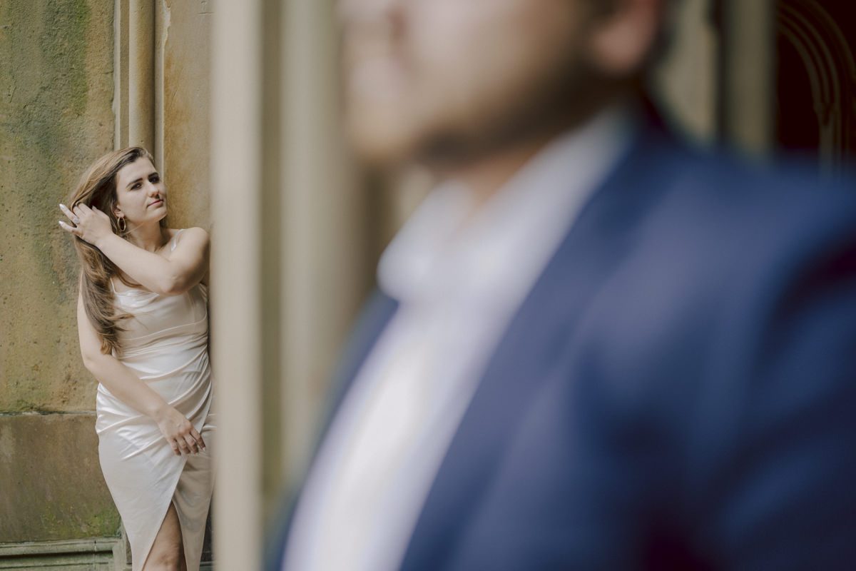 After trying to dodge multiple rains, scattered thunderstorms we met by Bethesda Fountain in Central Park NY. I saw Izzy and Brendan standing near crowded Bethesda Arcade. Dressed for their engagement session I took Izzy and Brendan to quiet corner of this jam packed Central Park. With maximum humidity in the air Izzy and Brendan was such a troopers in this heavy heat with crazy humidity in the air they smiles, laughed and cursed. The good ol'NY way, together with Izzy and Brendan we were weird, sarcastic, funny walking around Central Park. At some point it actually started drizzling then turned into heavy rain but we took covers under the trees and continued shooting. It was so fun photographing two people who cared less about how they looked in the humidity but just wanted to have fun! Again I love my careless, self loving humans and can't wait for Izzy and Brendan's wedding at Arrow Park this year. Izzy and Brendan's Central Park NY engagement documented by by Karis | Hey Karis | Catskills, Hudson Valley NY elopement and wedding photographer | Brooklyn NY elopement and wedding photographer | Manhattan NY elopement and wedding photographer | Hey Karis is fun documentary wedding and elopement photographer.
