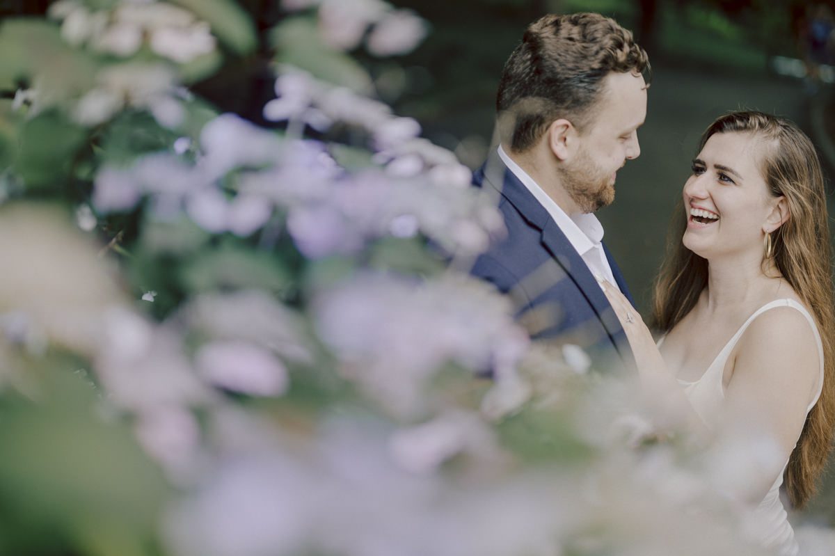 After trying to dodge multiple rains, scattered thunderstorms we met by Bethesda Fountain in Central Park NY. I saw Izzy and Brendan standing near crowded Bethesda Arcade. Dressed for their engagement session I took Izzy and Brendan to quiet corner of this jam packed Central Park. With maximum humidity in the air Izzy and Brendan was such a troopers in this heavy heat with crazy humidity in the air they smiles, laughed and cursed. The good ol'NY way, together with Izzy and Brendan we were weird, sarcastic, funny walking around Central Park. At some point it actually started drizzling then turned into heavy rain but we took covers under the trees and continued shooting. It was so fun photographing two people who cared less about how they looked in the humidity but just wanted to have fun! Again I love my careless, self loving humans and can't wait for Izzy and Brendan's wedding at Arrow Park this year. Izzy and Brendan's Central Park NY engagement documented by by Karis | Hey Karis | Catskills, Hudson Valley NY elopement and wedding photographer | Brooklyn NY elopement and wedding photographer | Manhattan NY elopement and wedding photographer | Hey Karis is fun documentary wedding and elopement photographer.
