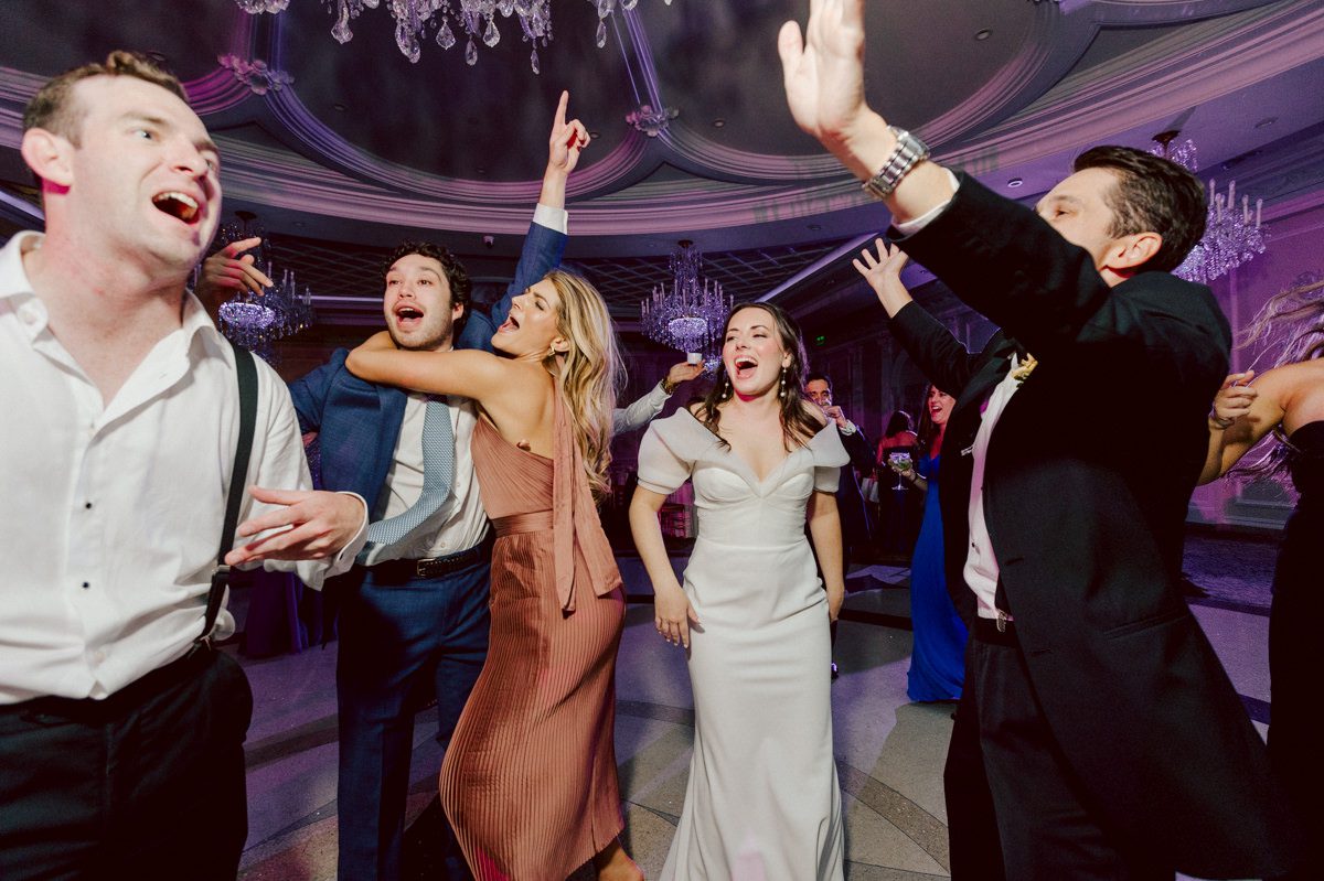 Jackie and Nick the two New Yorkers wanted to get away from busy packed streets of NY and get married in NJ, The Rockleigh NJ. Jackie got ready at her parents house in Hasbrouck Heights in NJ where her mom and bridesmaids showered her with love while they got ready together for her wedding. Nick also got ready at his parents house in Park Ridge NJ. Jackie & Nick got into their limos and drove to the chapel Our Lady of mercy Church in Park Ridge NJ for their wedding ceremony. Jackie and Nick's beautiful wedding ceremony was over at Our Lady of Mercy Church followed by family photos at the church before heading over to The Rockleigh for their wedding reception and to party! The Rockleigh's garden's were beautiful with flowers and perfectly manicured bushes, trees and flowers. I did all of Jackie and Nick's wedding photos at the garden at The Rockleigh including extended family photos, bridal party photos as well as newly weds couple's photos. Then Jackie and Nick joined their guests at their cocktail hour to start their wedding party. Fun and beautiful wedding reception continued till midnight at The Rockleigh. Jackie and Nick's The Rockleigh NJ Wedding documented by by Karis | Hey Karis | Catskills, Hudson Valley NY elopement and wedding photographer | Brooklyn NY elopement and wedding photographer | Manhattan NY elopement and wedding photographer | Hey Karis is fun documentary wedding and elopement photographer.