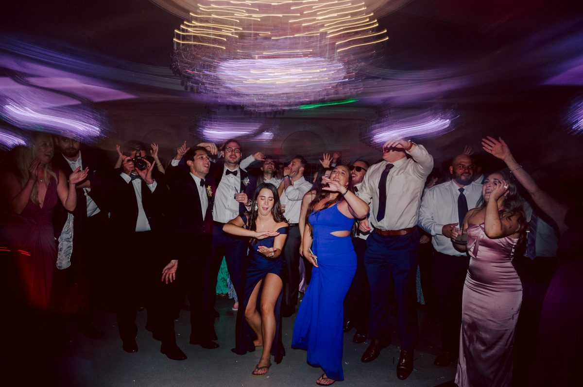 Jackie and Nick the two New Yorkers wanted to get away from busy packed streets of NY and get married in NJ, The Rockleigh NJ. Jackie got ready at her parents house in Hasbrouck Heights in NJ where her mom and bridesmaids showered her with love while they got ready together for her wedding. Nick also got ready at his parents house in Park Ridge NJ. Jackie & Nick got into their limos and drove to the chapel Our Lady of mercy Church in Park Ridge NJ for their wedding ceremony. Jackie and Nick's beautiful wedding ceremony was over at Our Lady of Mercy Church followed by family photos at the church before heading over to The Rockleigh for their wedding reception and to party! The Rockleigh's garden's were beautiful with flowers and perfectly manicured bushes, trees and flowers. I did all of Jackie and Nick's wedding photos at the garden at The Rockleigh including extended family photos, bridal party photos as well as newly weds couple's photos. Then Jackie and Nick joined their guests at their cocktail hour to start their wedding party. Fun and beautiful wedding reception continued till midnight at The Rockleigh. Jackie and Nick's The Rockleigh NJ Wedding documented by by Karis | Hey Karis | Catskills, Hudson Valley NY elopement and wedding photographer | Brooklyn NY elopement and wedding photographer | Manhattan NY elopement and wedding photographer | Hey Karis is fun documentary wedding and elopement photographer.