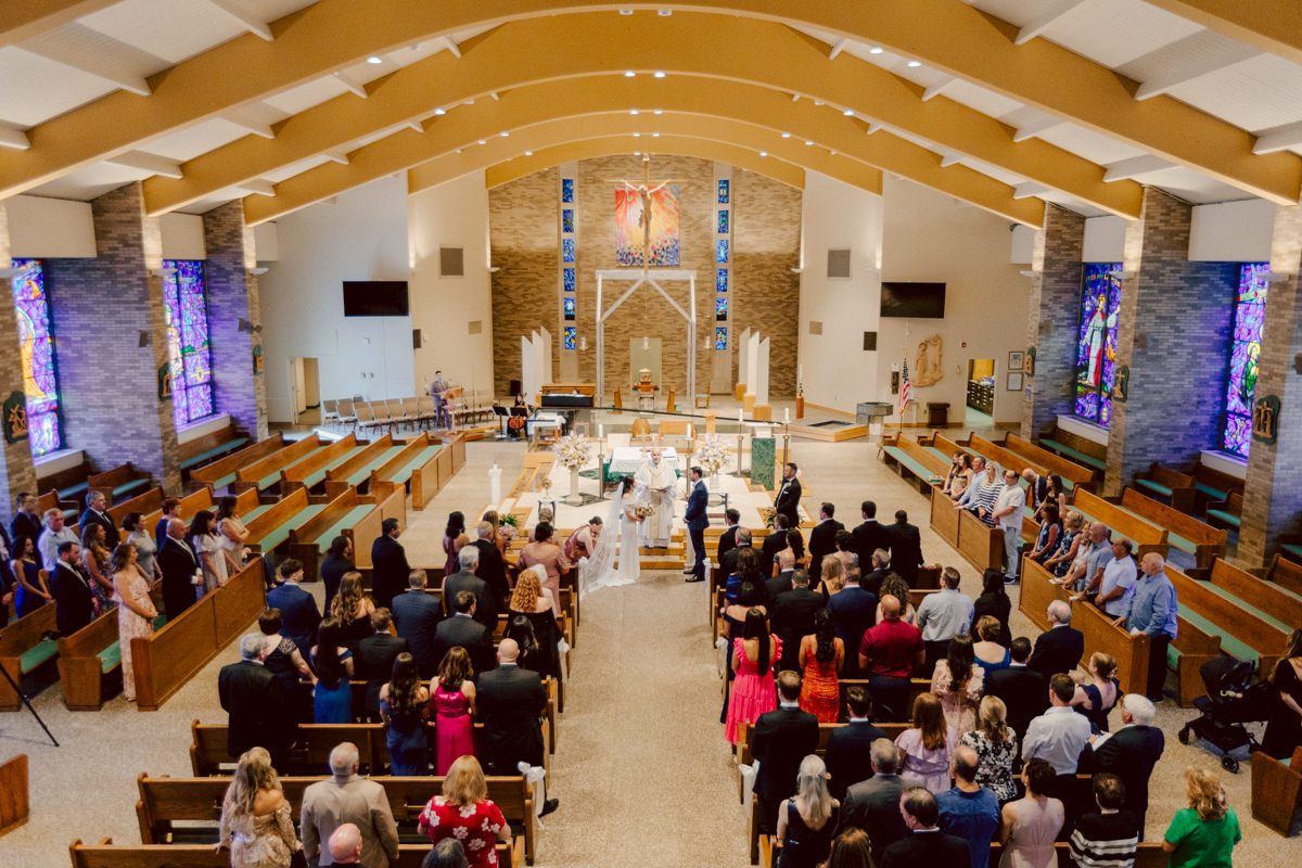 Jackie and Nick the two New Yorkers wanted to get away from busy packed streets of NY and get married in NJ, The Rockleigh NJ. Jackie got ready at her parents house in Hasbrouck Heights in NJ where her mom and bridesmaids showered her with love while they got ready together for her wedding. Nick also got ready at his parents house in Park Ridge NJ. Jackie & Nick got into their limos and drove to the chapel Our Lady of mercy Church in Park Ridge NJ for their wedding ceremony. Jackie and Nick's beautiful wedding ceremony was over at Our Lady of Mercy Church followed by family photos at the church before heading over to The Rockleigh for their wedding reception and to party! The Rockleigh's garden's were beautiful with flowers and perfectly manicured bushes, trees and flowers. I did all of Jackie and Nick's wedding photos at the garden at The Rockleigh including extended family photos, bridal party photos as well as newly weds couple's photos. Then Jackie and Nick joined their guests at their cocktail hour to start their wedding party. Fun and beautiful wedding reception continued till midnight at The Rockleigh. Jackie and Nick's The Rockleigh NJ Wedding documented by by Karis | Hey Karis | Catskills, Hudson Valley NY elopement and wedding photographer | Brooklyn NY elopement and wedding photographer | Manhattan NY elopement and wedding photographer | Hey Karis is fun documentary wedding and elopement photographer.